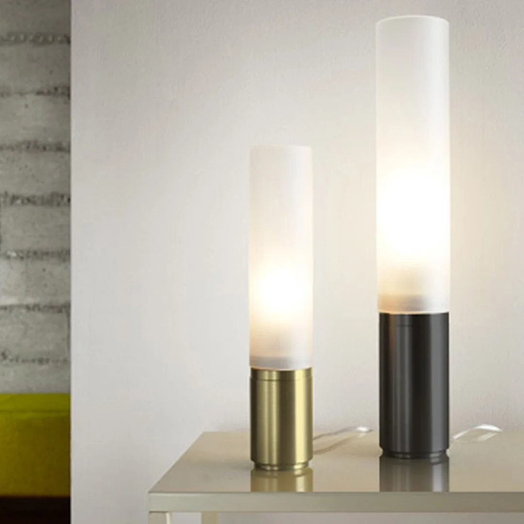 Pablo Elise Table Lamps in brass and black finishes displayed on side table