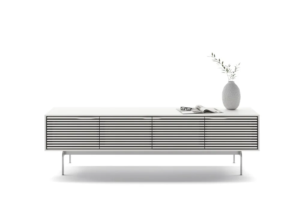 Front view of the Align Low Quad Cabinet in white with horizontal slatted doors and decor on top