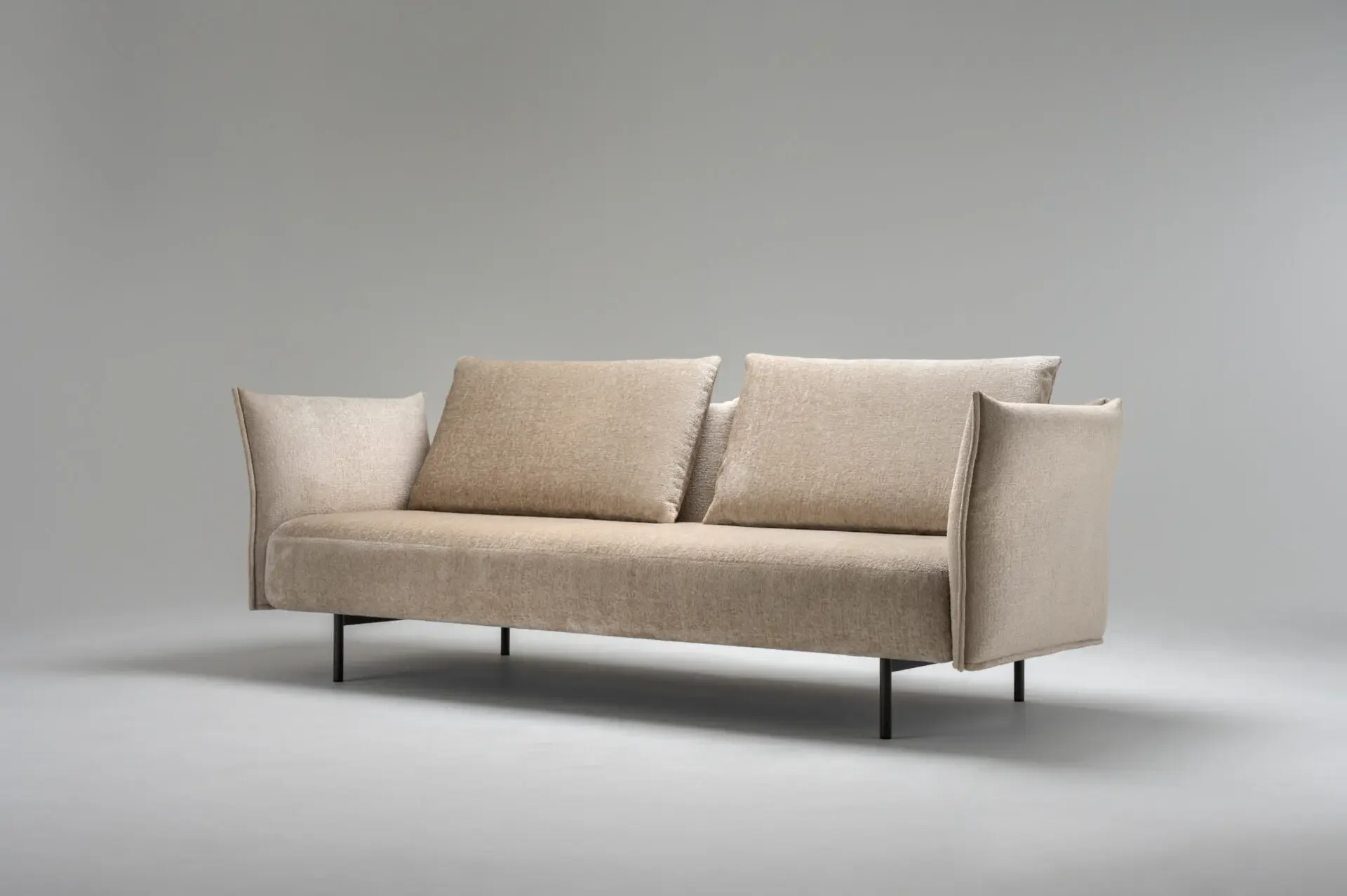 Beige Trica Le Beaumont Sofa in modern studio setting, front view