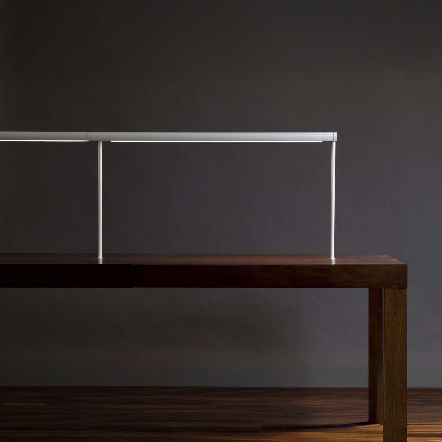 Minimalist Sobre LED desk lamp on modern wood desk