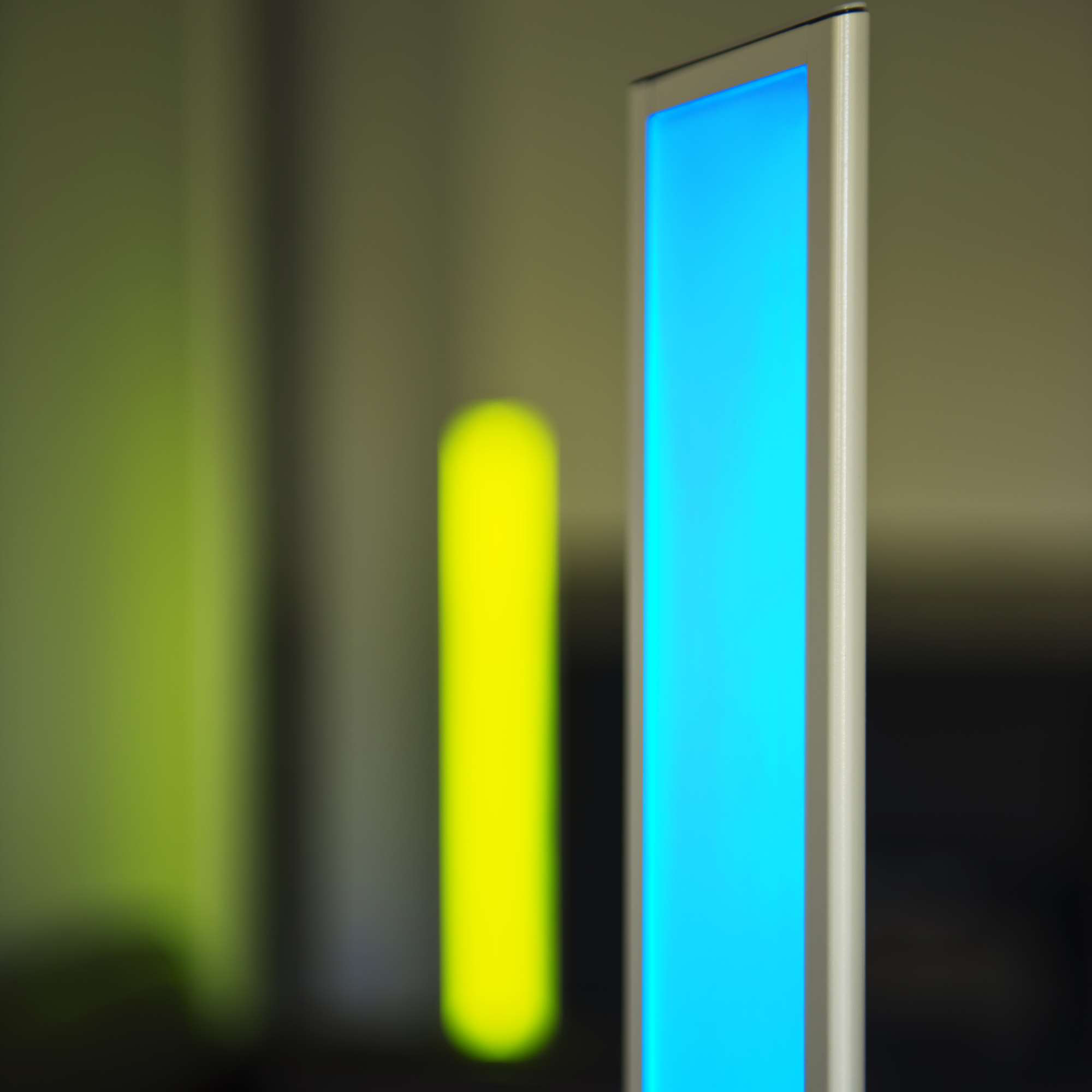 Close-up of Koncept Tono Mood Light showing vivid blue and yellow LED colors