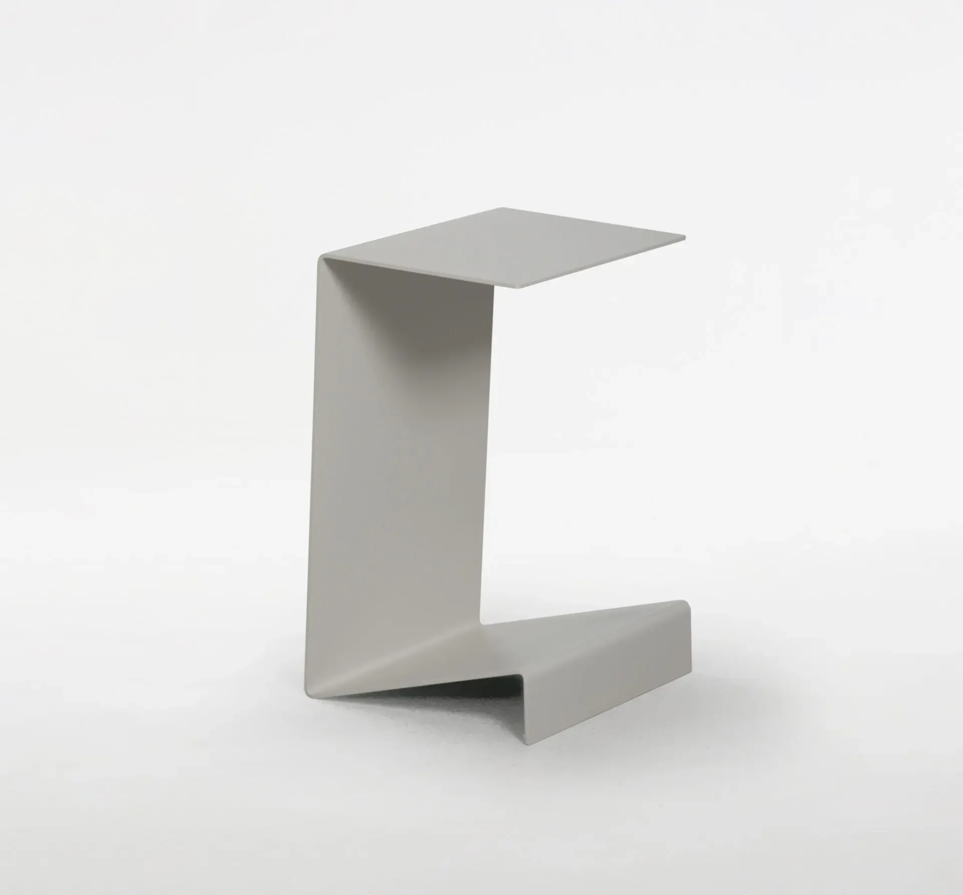 Zigzag End Table in light grey with sculptural angular design