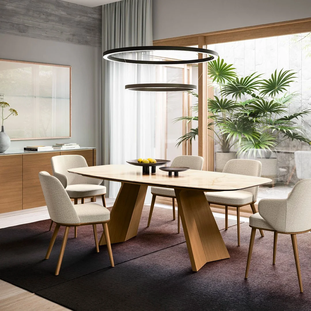 Icaro Table with marble top styled in a bright modern dining room with wood accents