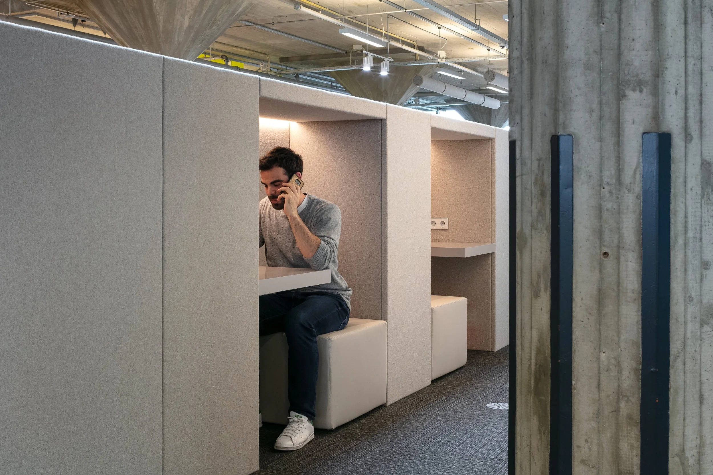 Phone booth against grey wall at Yuki HQ office, Rotterdam, designed by Meeder Ontwerpers.
