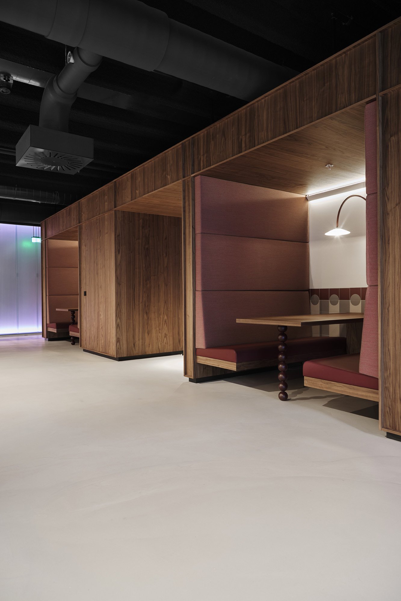 Wood meeting pod and phone booths in a row at KBF Warehouse, Amsterdam. Designed by Meeder Ontwerpers