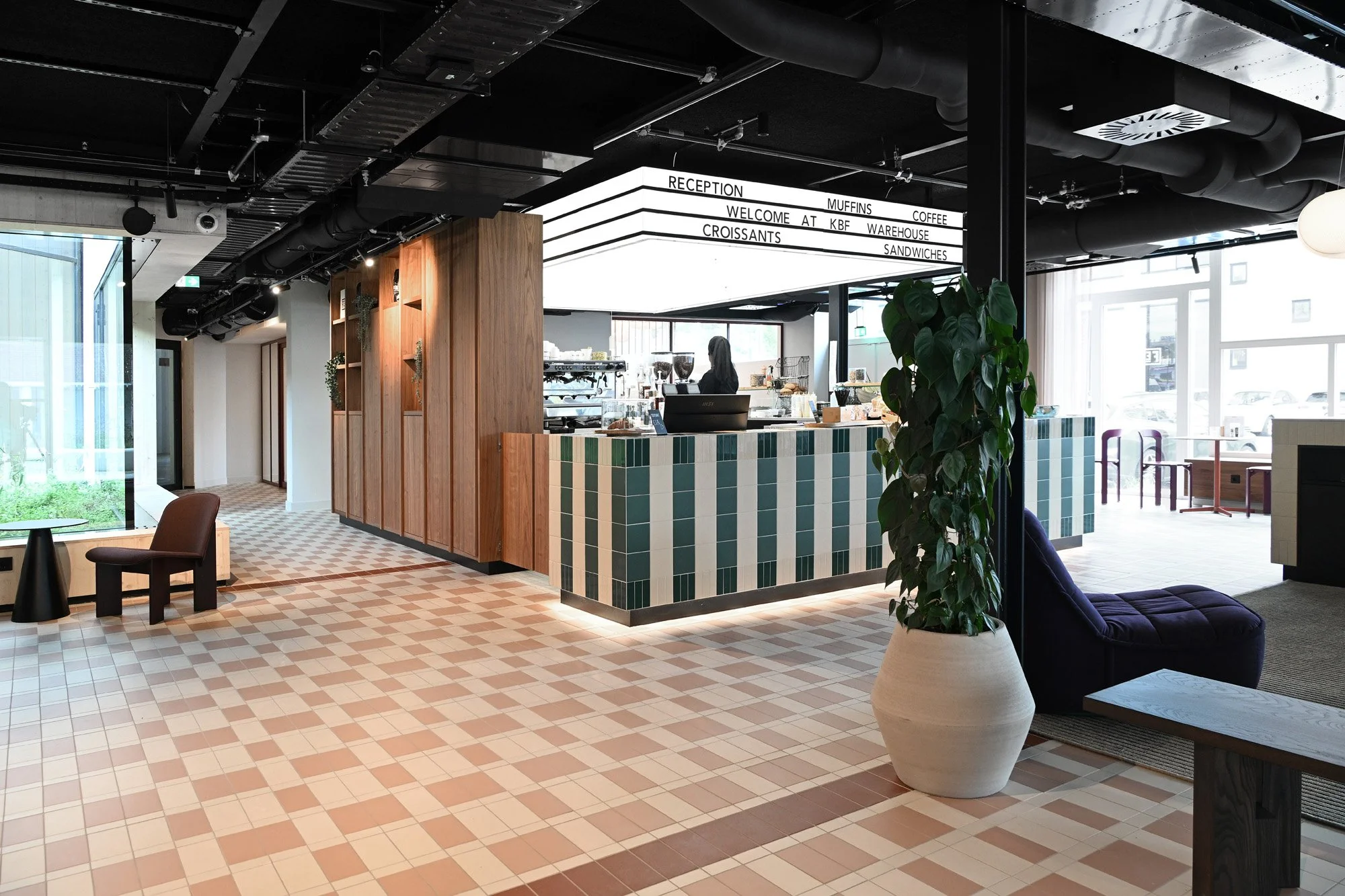 Café with striped counter at KBF warehouse designed by Meeder Ontwerpers