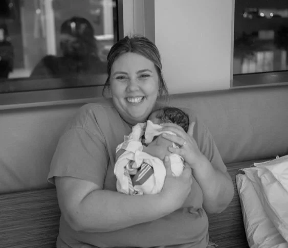 doula-holding baby while mom rests at hospital-lakeland