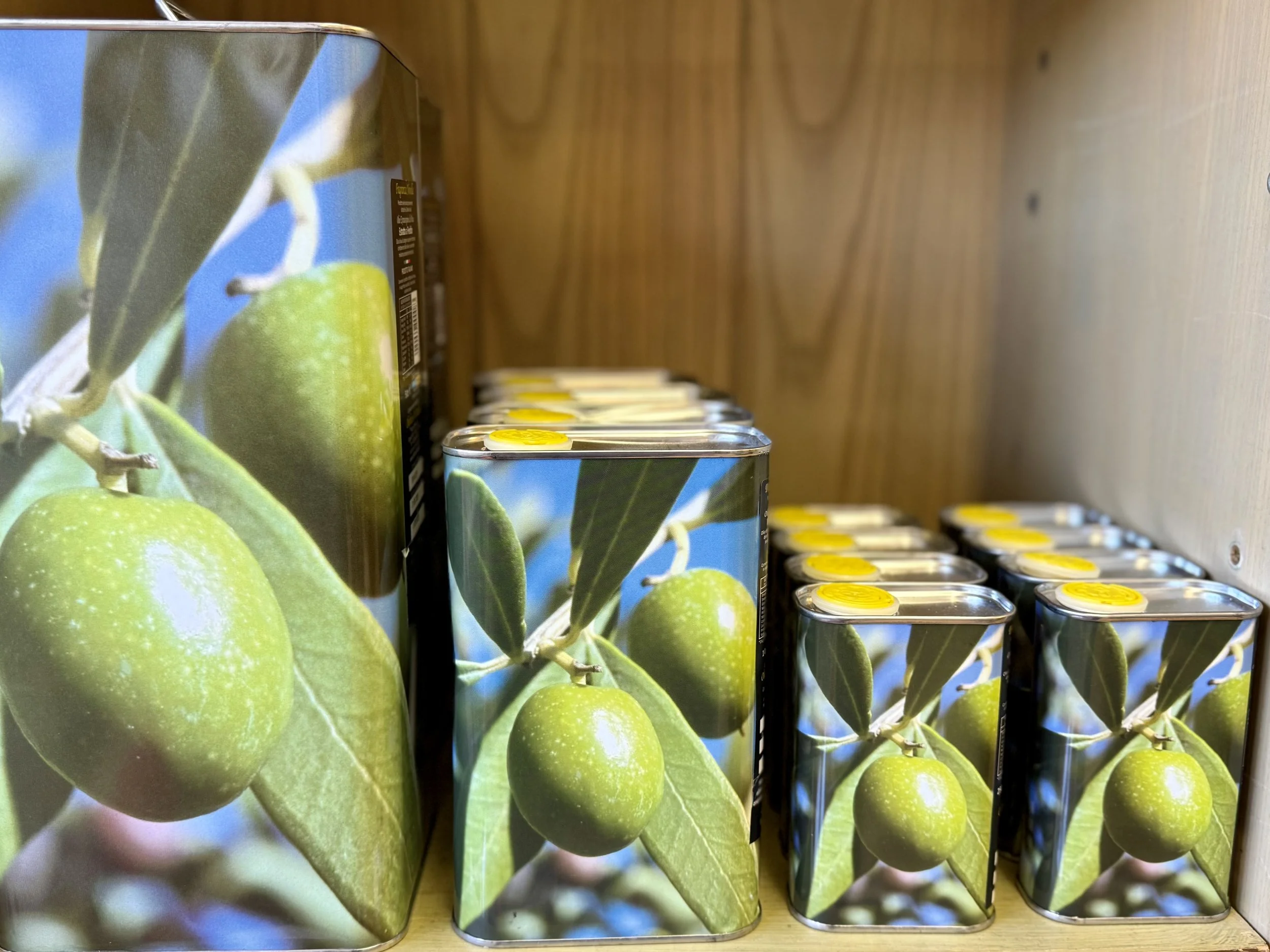 Tins of extra virgin olive oil  at Gastro Nicks