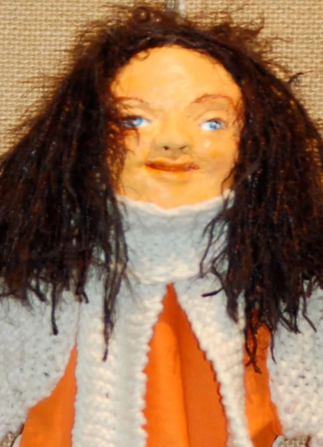 Orange Puppet is a mixed media 12" X 12 “artwork combining: paper clay, fabric, yarn, and wood dowels.   Pamela Eveline’s artwork and lessons are available to encourage and inspire you to create your visions.