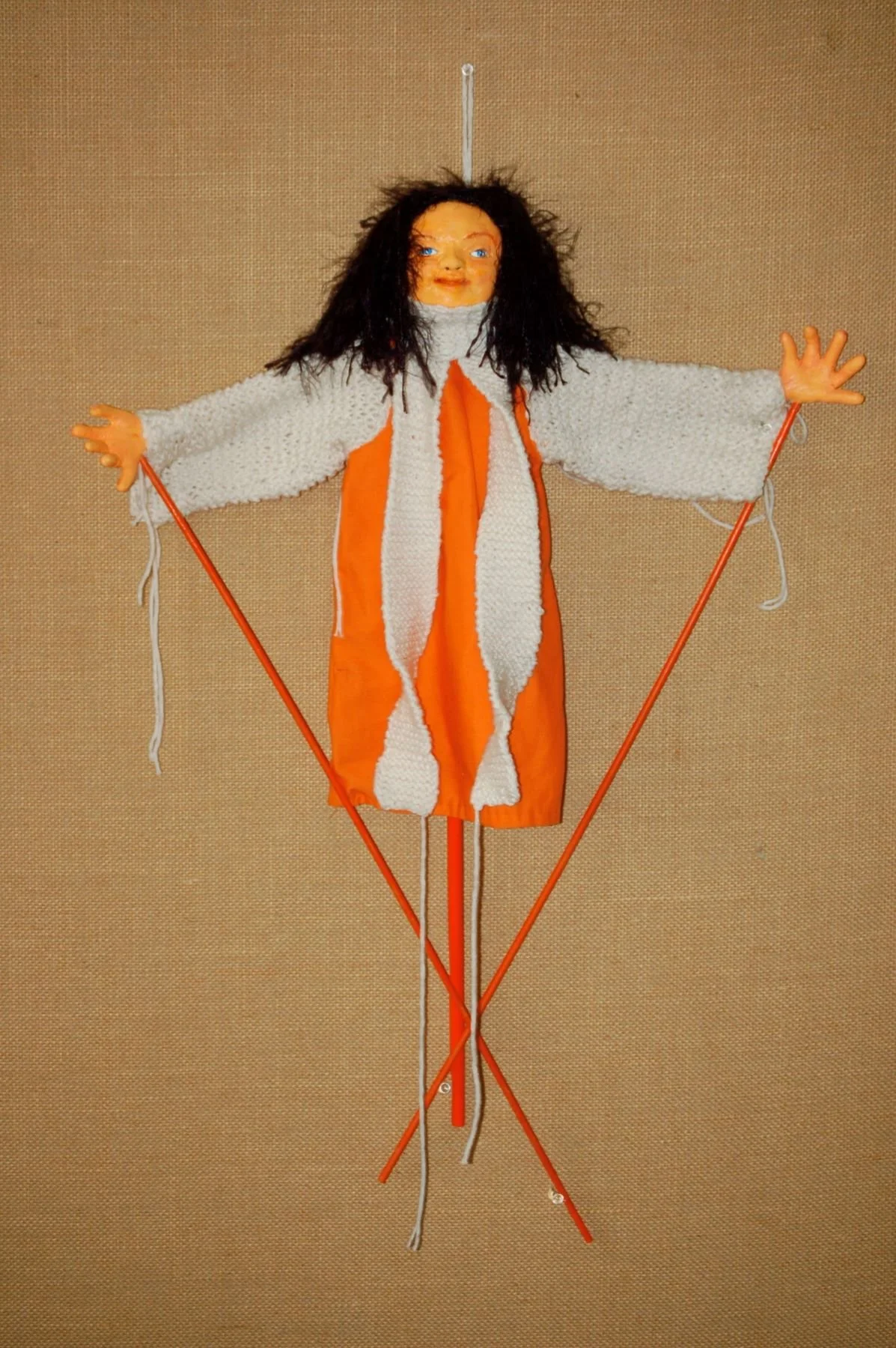 Orange Puppet is a mixed media 12 "X 12 “artwork combining: paper clay, fabric, yarn, and wood dowels.   Pamela Eveline’s artwork and lessons are available to encourage and inspire you to create your visions.