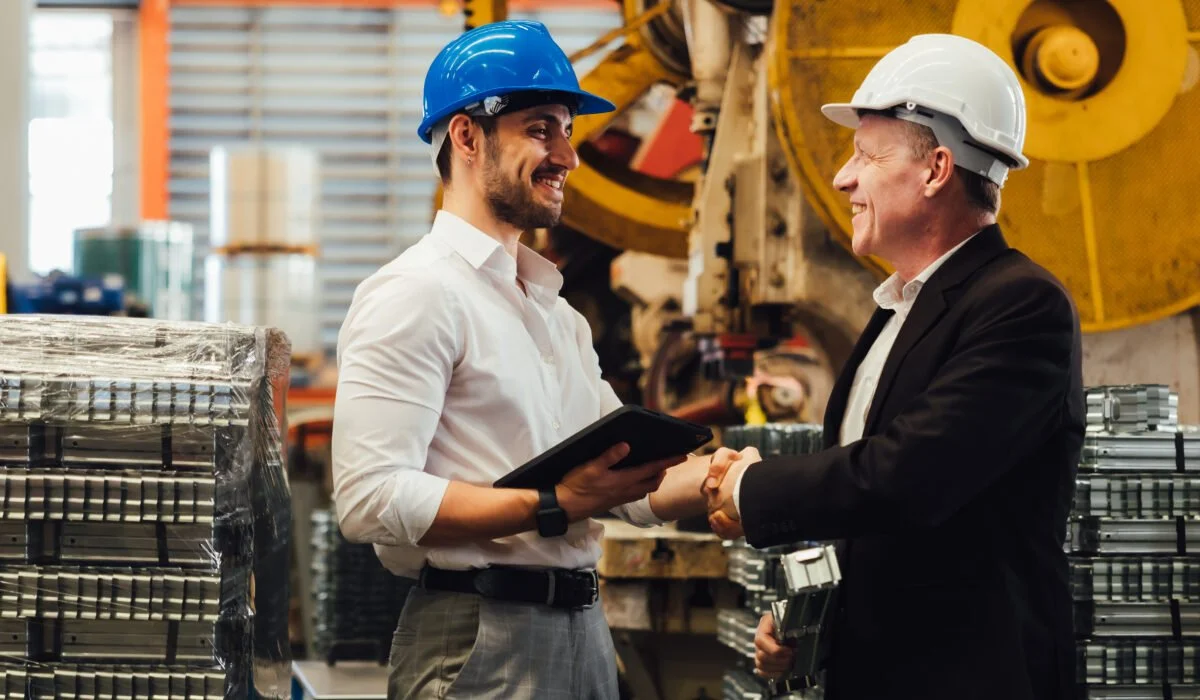 Construction business brokers reviewing a commercial jobsite before a company sale