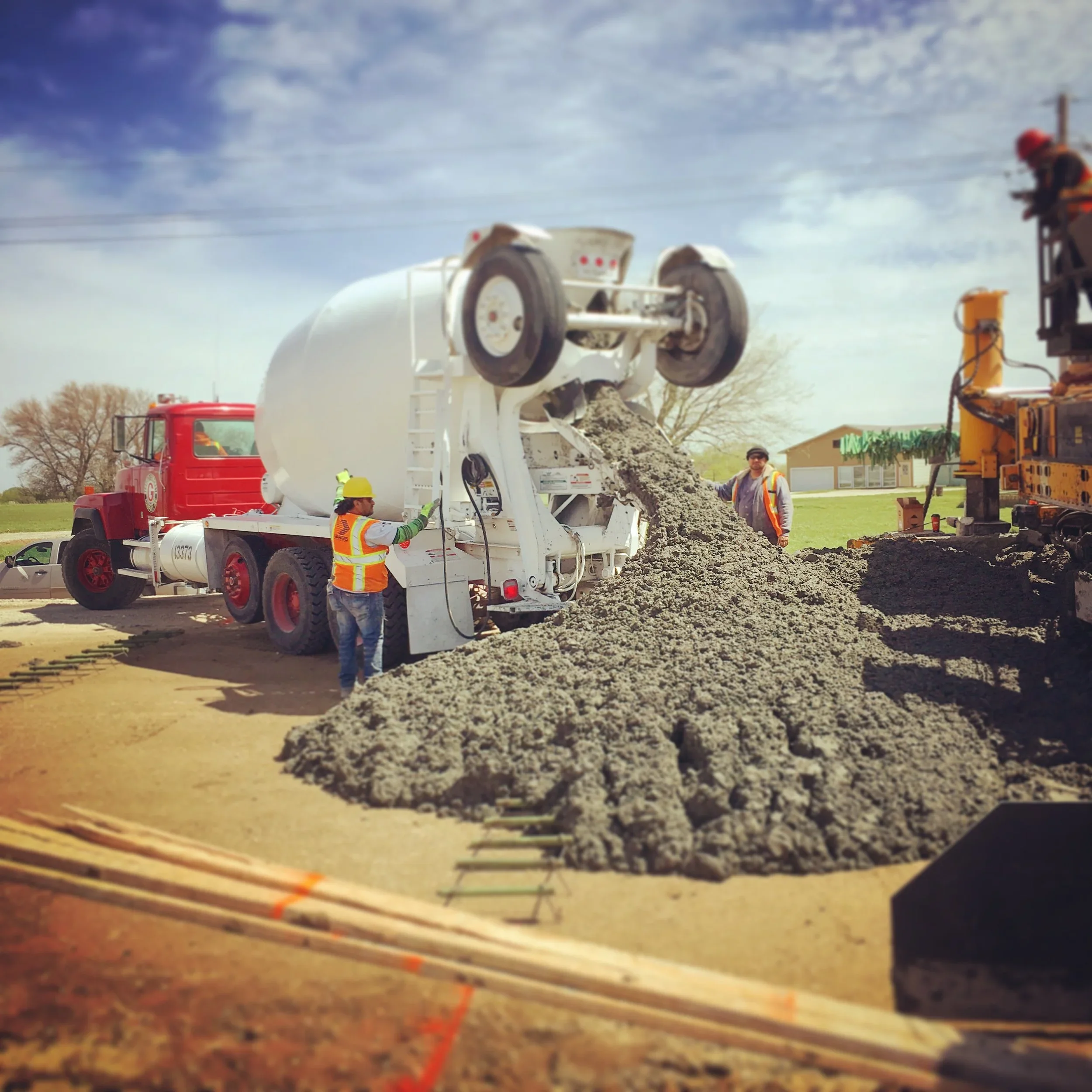 Ready-mix truck delivering concrete to an active construction project