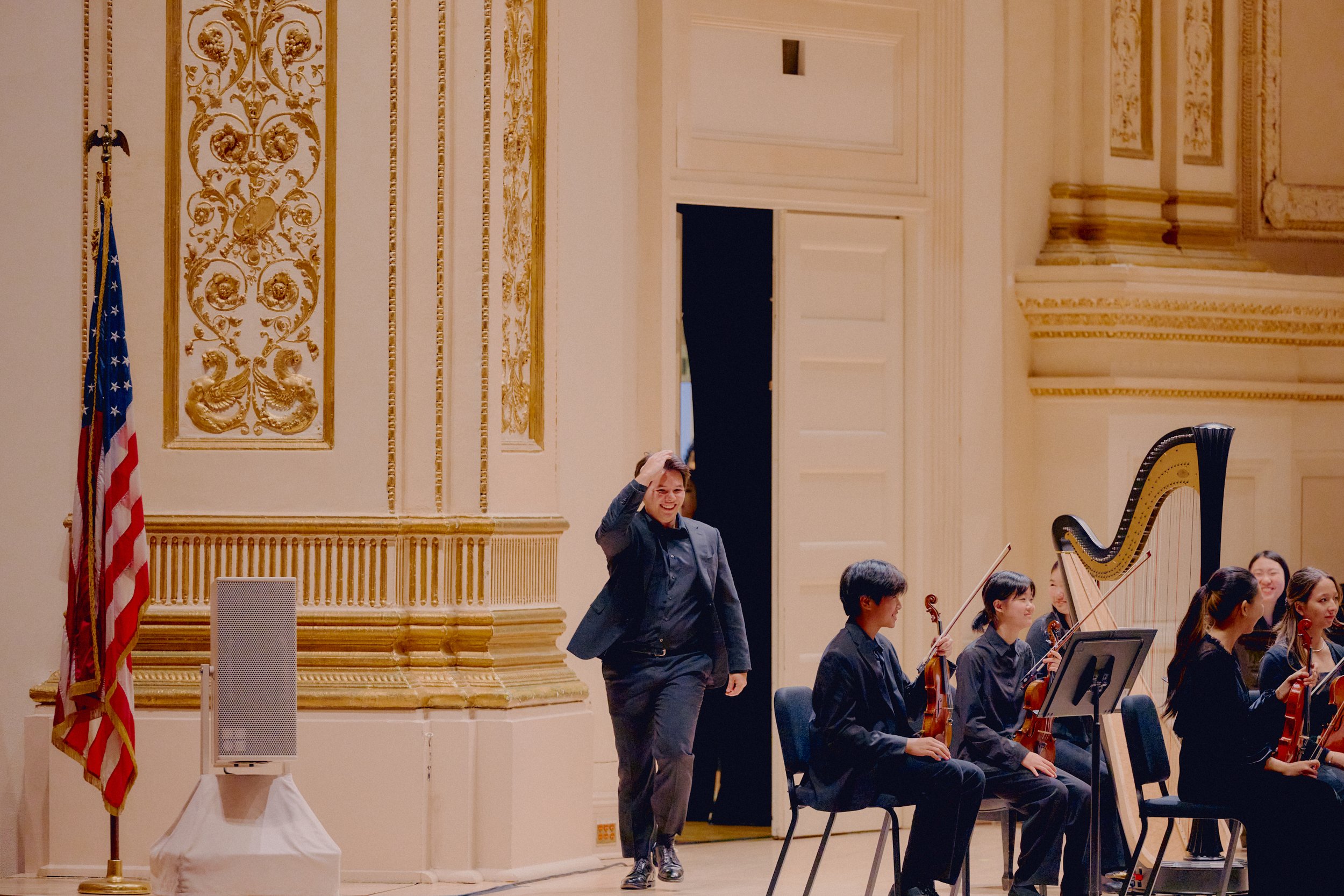 Conductor Adrian Rogers Walking Onstage to Carnegie Hall