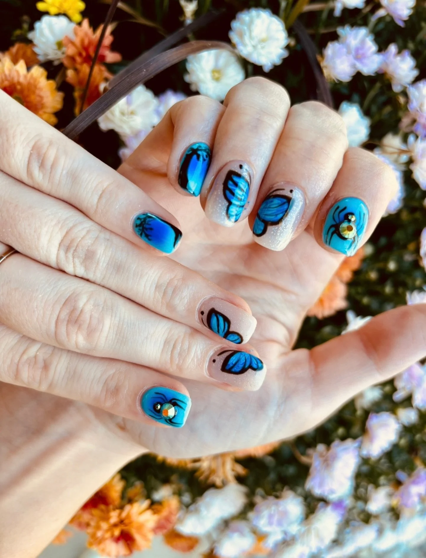 These nails by Jasmine have us dreaming of Spring 🦋💭 Less than a month left of winter!  Celebrate by booking your next nail set with our girl @jasmines.nail.bar 

Call/text us to book &mdash; 269.716.4634

#nailart #butterflynails #springnails #bri