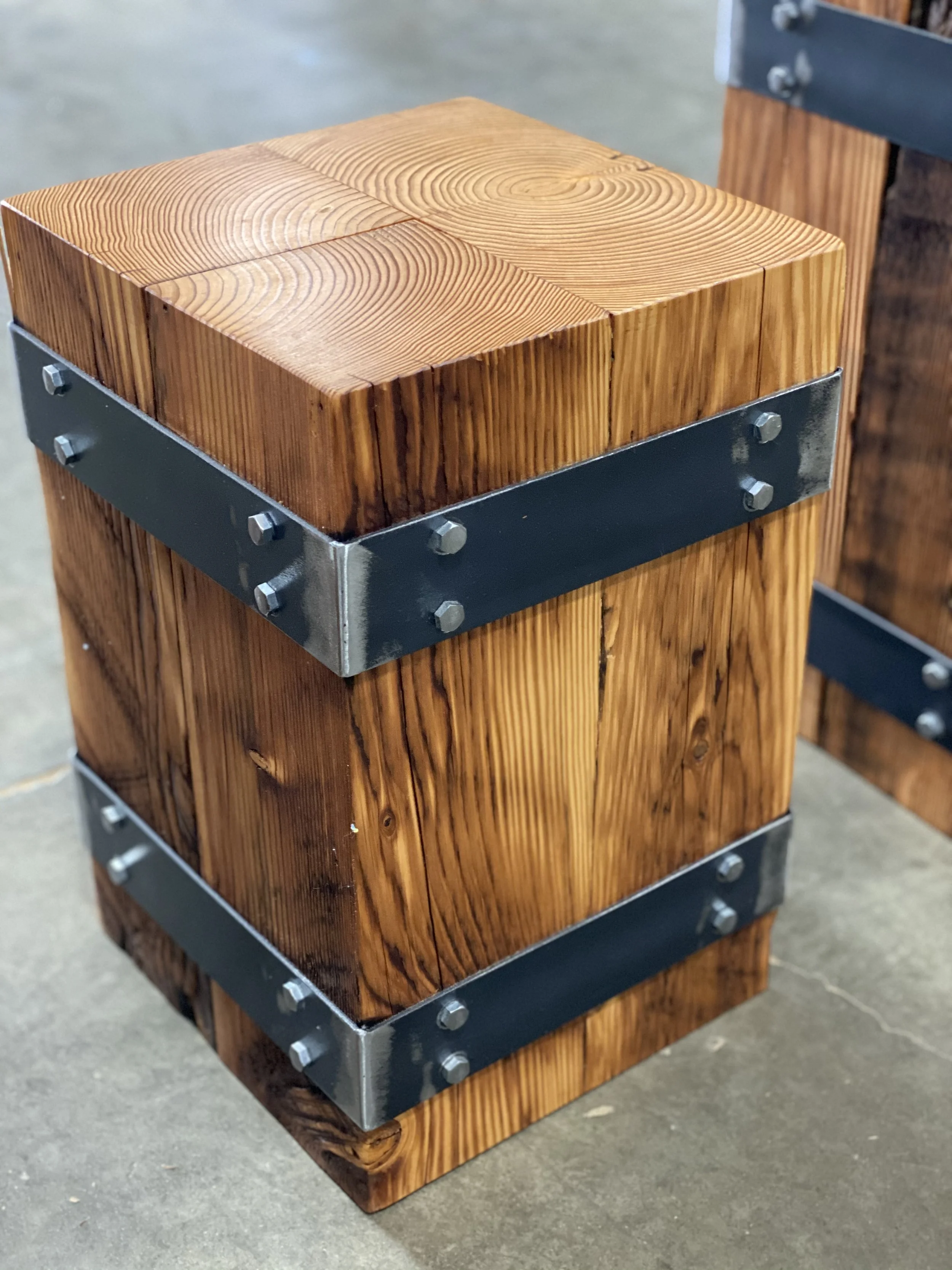 Wooden block stool with metal bands