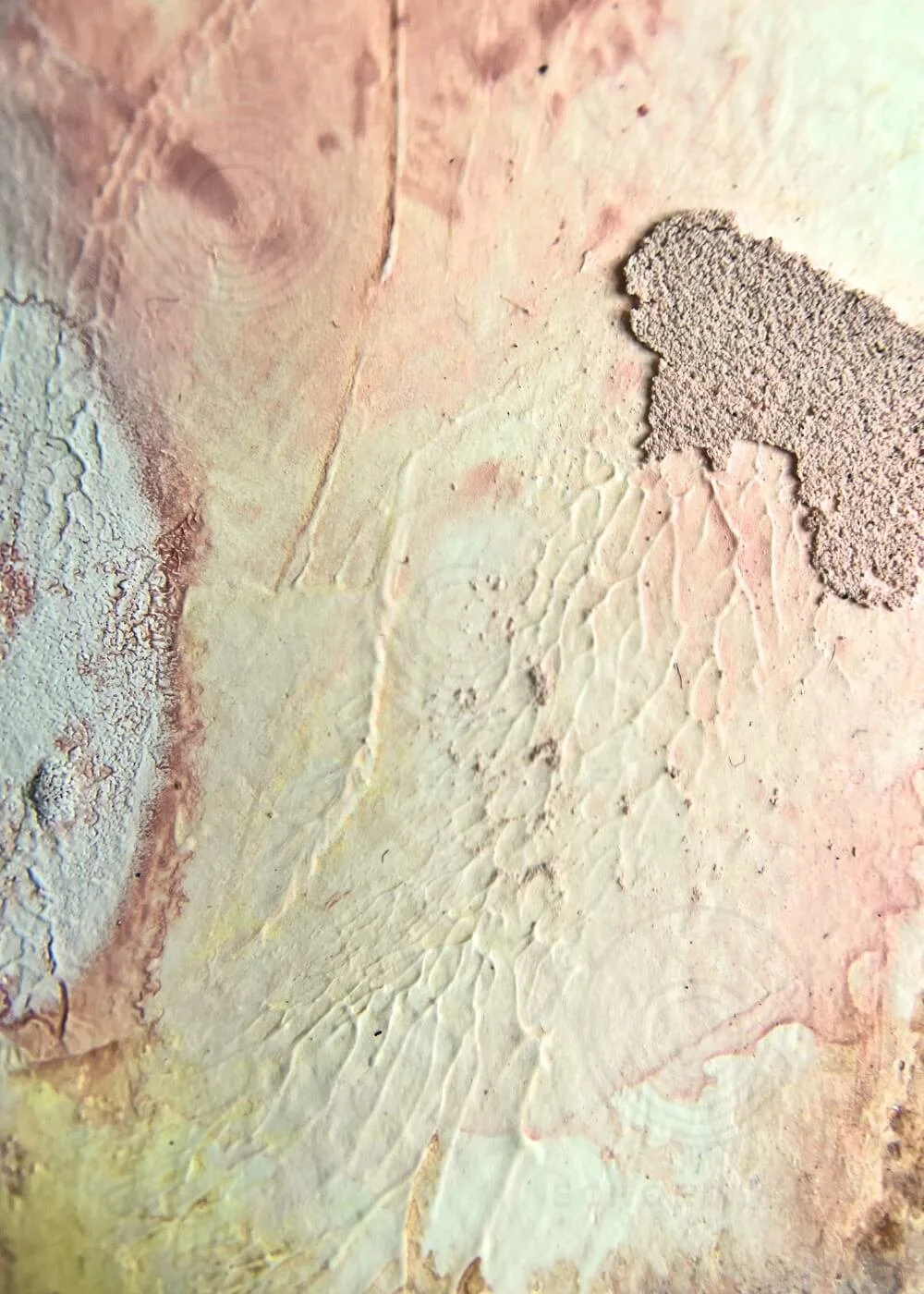 Macro detail of “Held by Myself No. 8,” showing layered yellow, rose, and textured paint with visible ridges and depth.