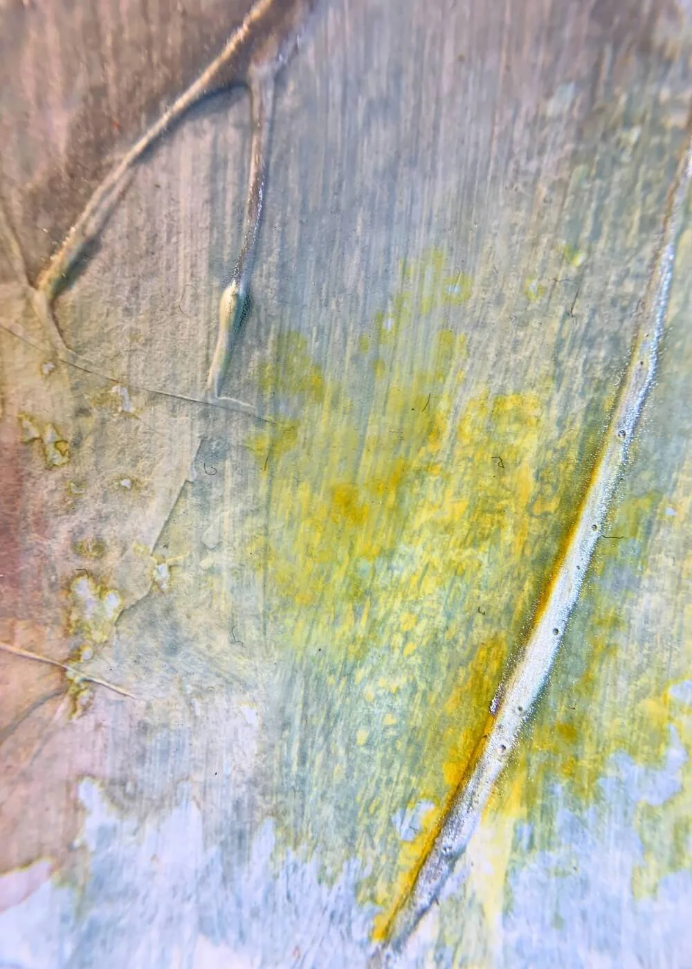 Detailed macro view of the artwork "Between the Seconds No. 2"  showing yellow textured paint layers with subtle surface structure.
