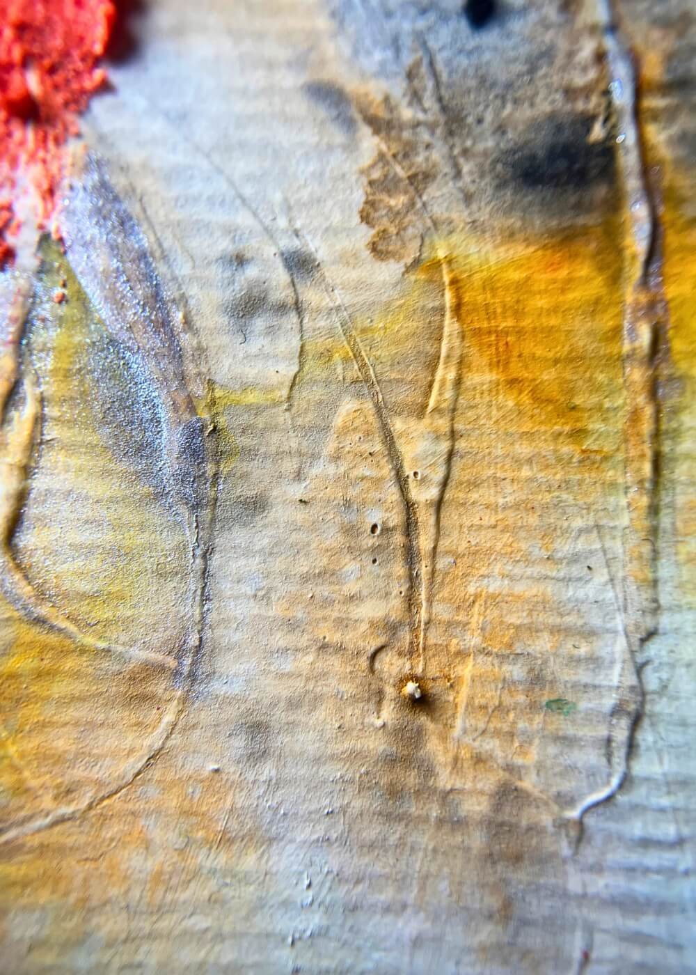Macro shot of golden-yellow textured surface with fine lines from original abstract artwork.