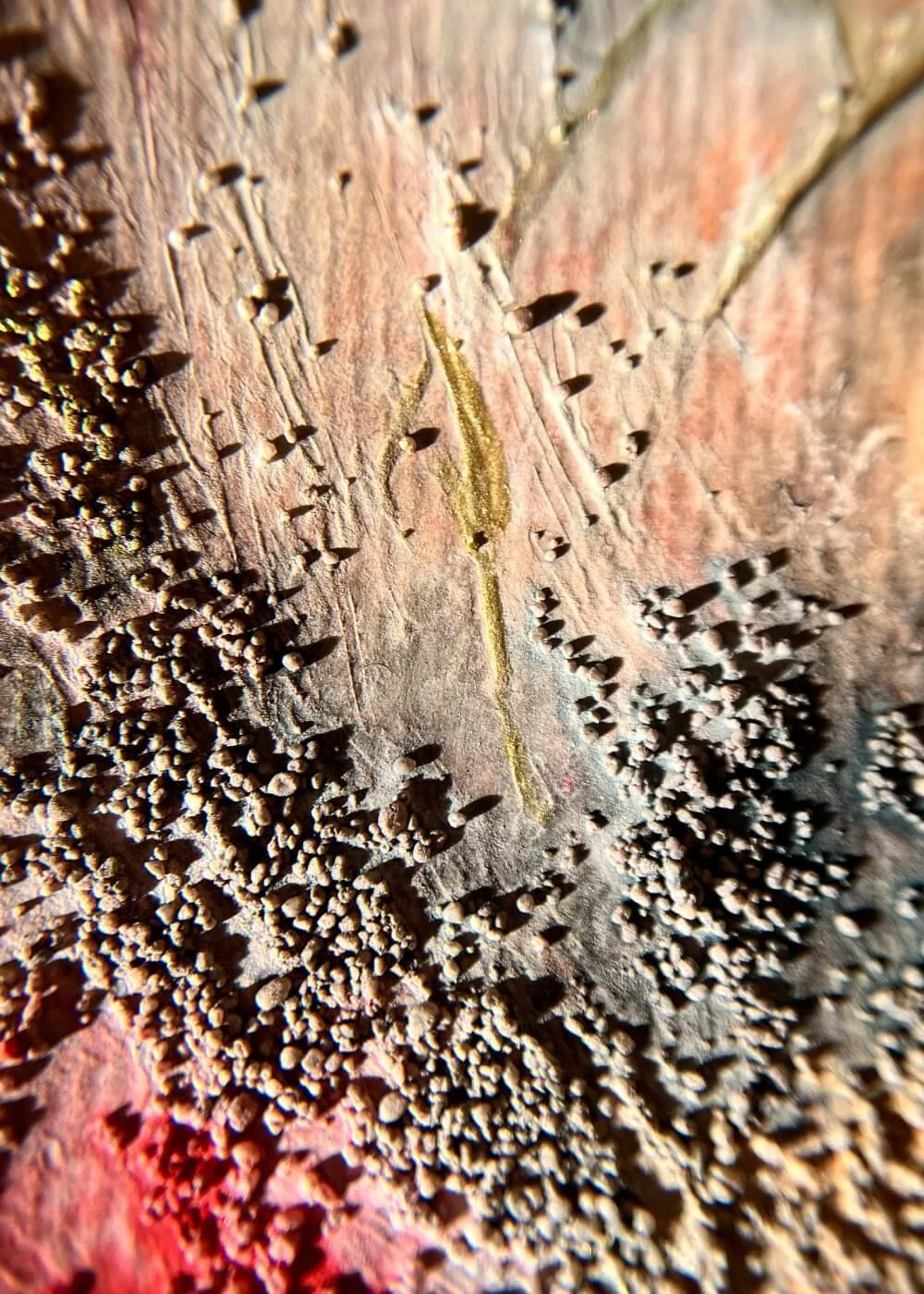 Shadows of gold and soot merge with pale grey — a horizon forming where smoke finally meets sky.