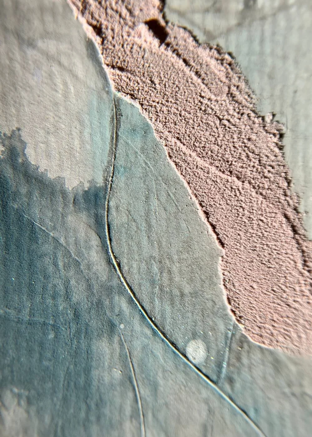 Close-up view of pink plaster texture blending into misty teal pigment, capturing the meditative, sensory depth of In the Space Between Thoughts.