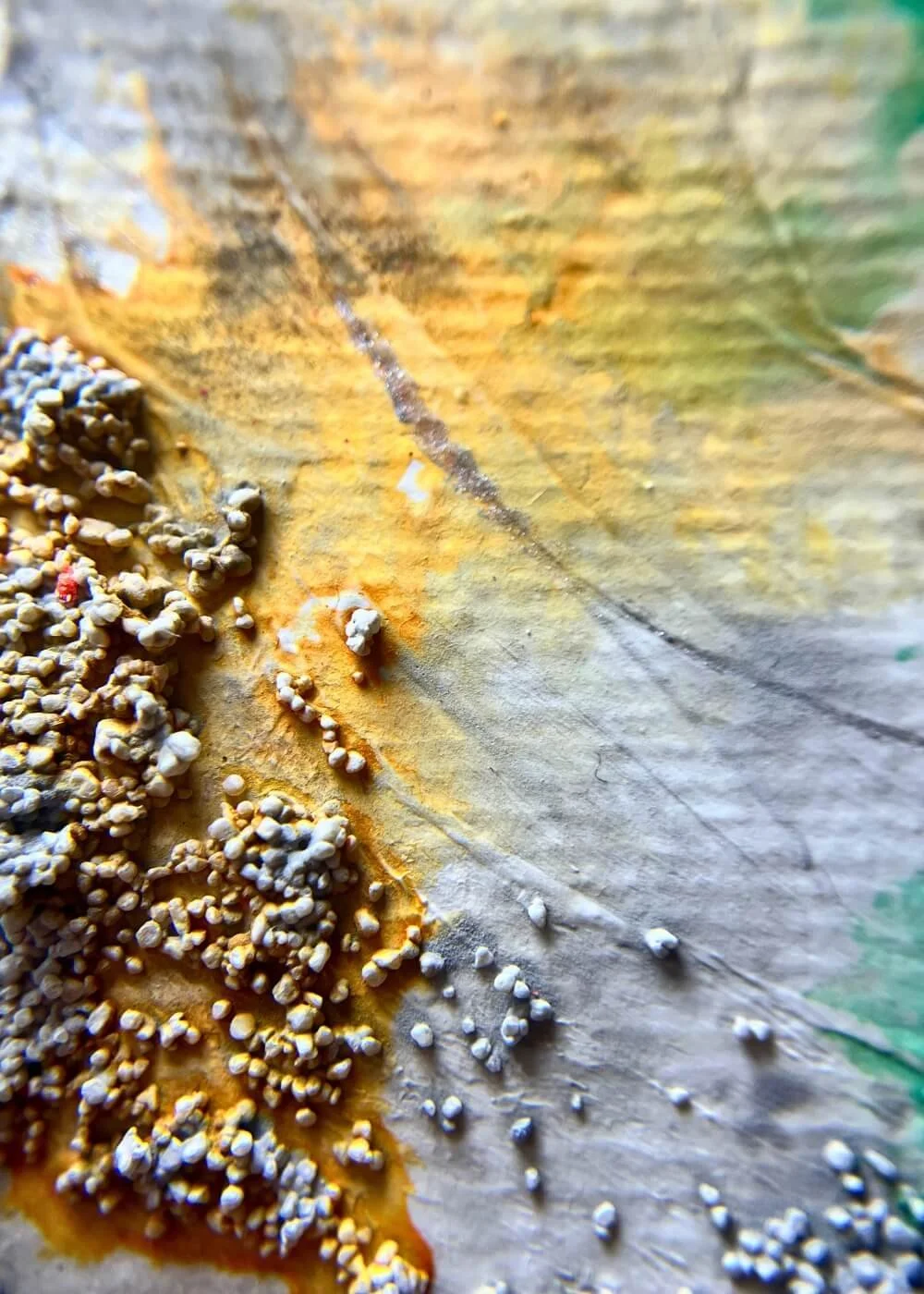 Detailed macro of golden and gray texture with raised tactile surface from mixed media artwork "Where I Draw the Line".