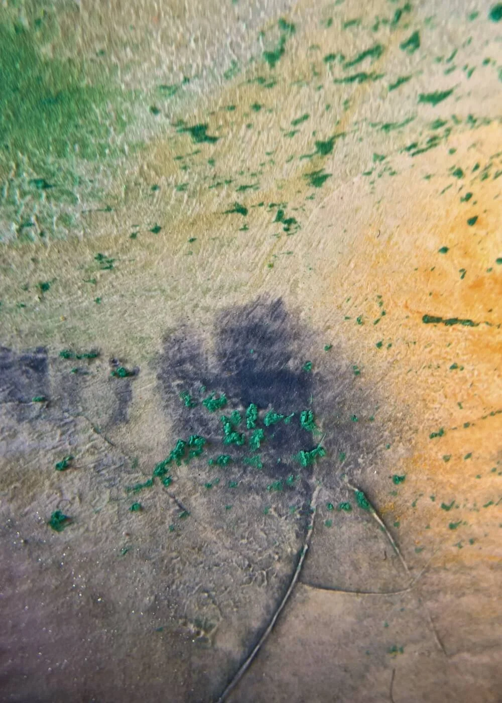 Macro detail of dark textured pigment blending into soft green and orange layers in ‘What was and what will be’, highlighting depth and the passage between past and future.