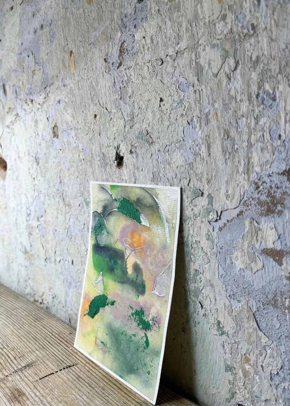 Side angle of ‘And something in me begins to flow’, healing abstract mixed media piece with flowing textures in emerald, violet, and warm orange tones.