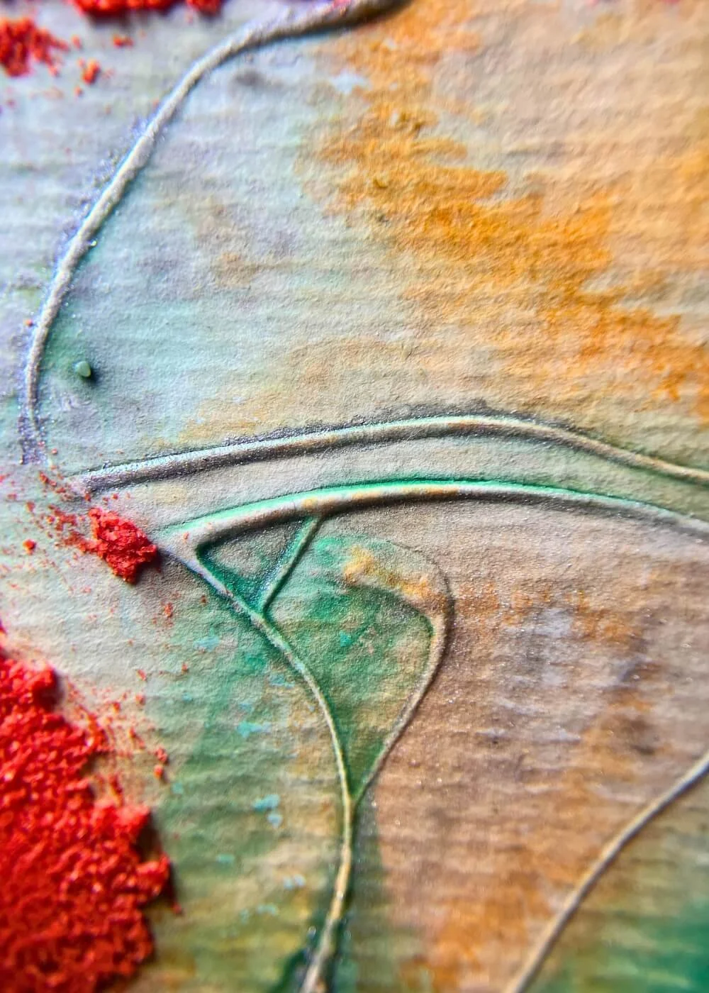 Macro detail of embossed abstract painting Where I kept my spark safe – red pigments, green strokes, and carved lines creating depth and energy.