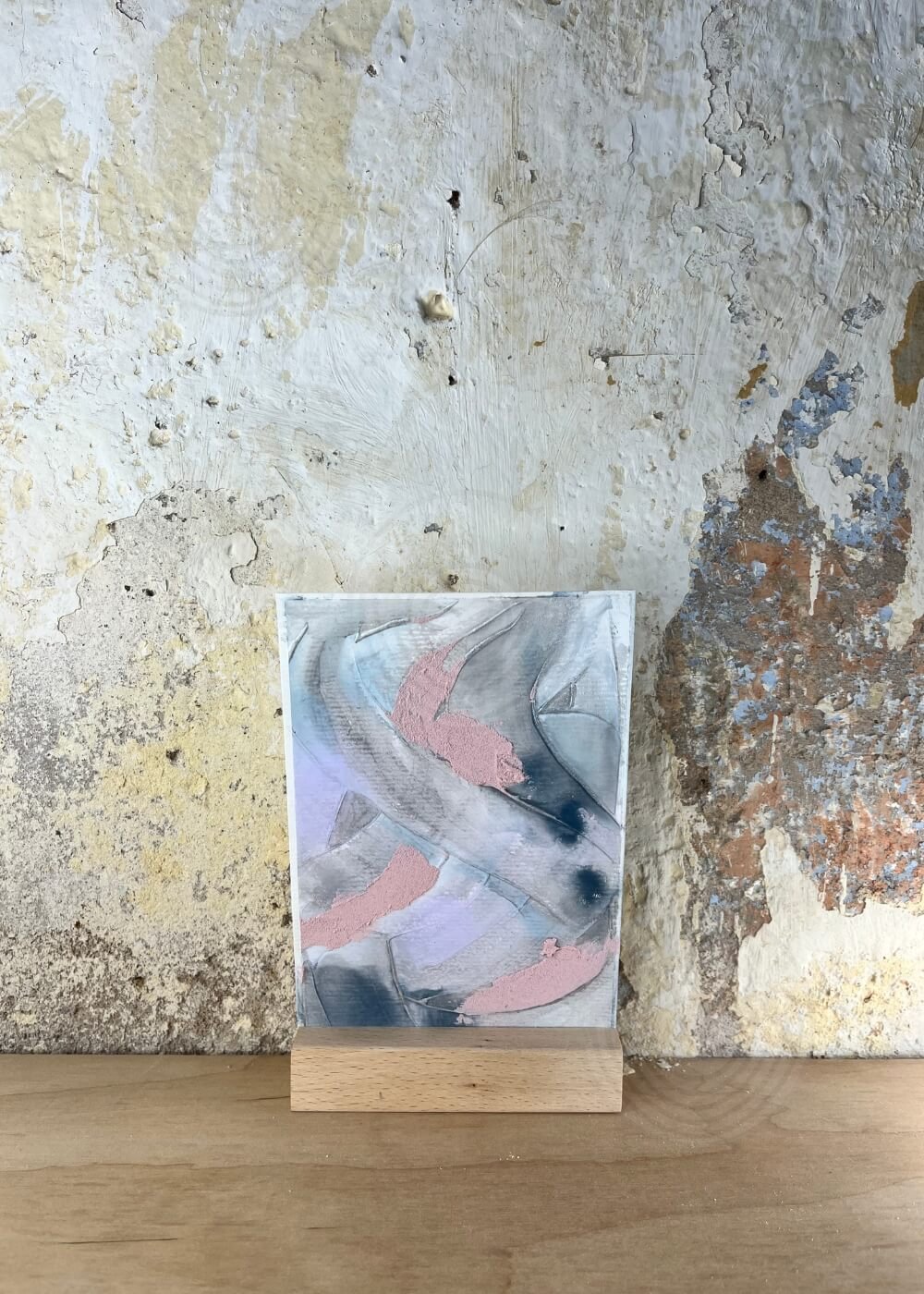 Abstract mixed-media artwork A Whisper of Memory in hues of rose, slate, and blue, symbolizing healing through stillness and emotional restoration.