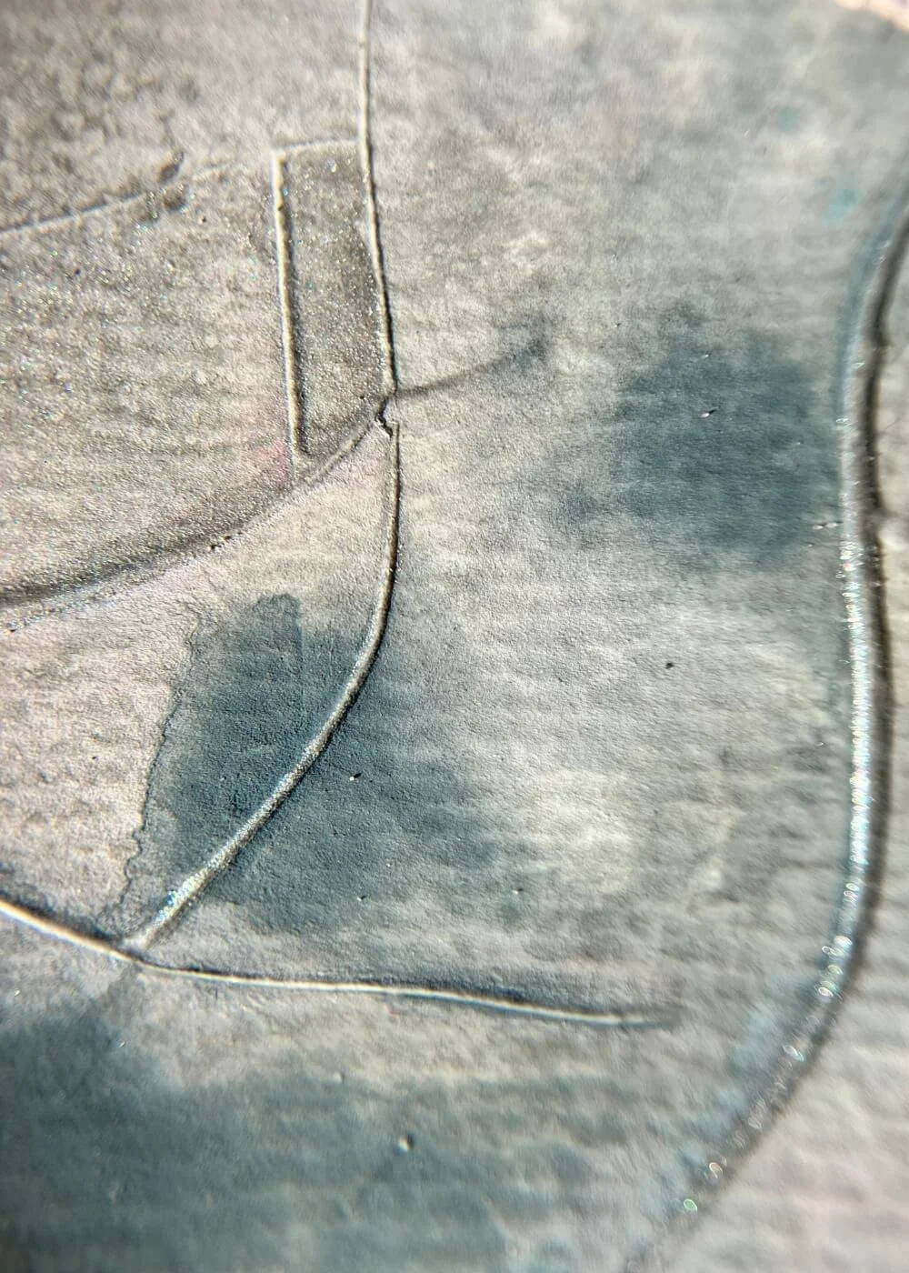 Macro detail of blue-grey textures merging softly with blush tones, representing the flow of breath as a quiet act of healing.