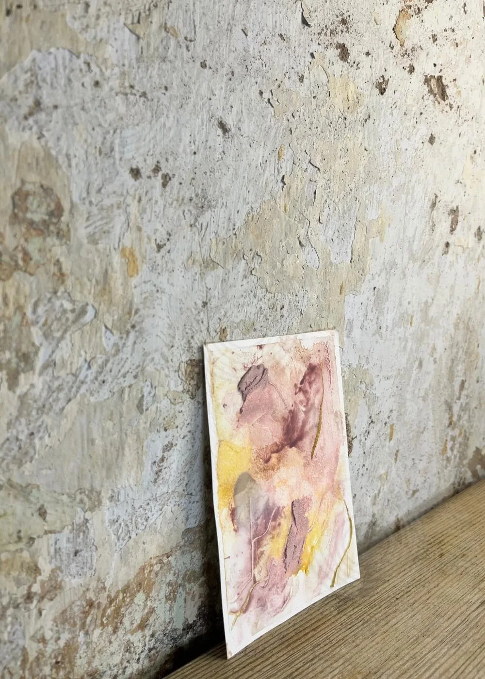 Healing tactile art piece “Held by Myself No. 5,” captured at an angle to highlight raised textures in warm rose and golden tones.