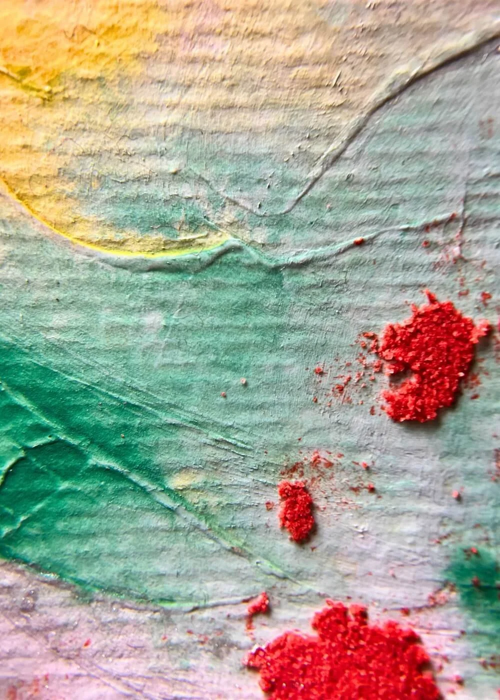 Close-up detail of textured green and red surface from abstract mixed media painting Even Now I Shine.
