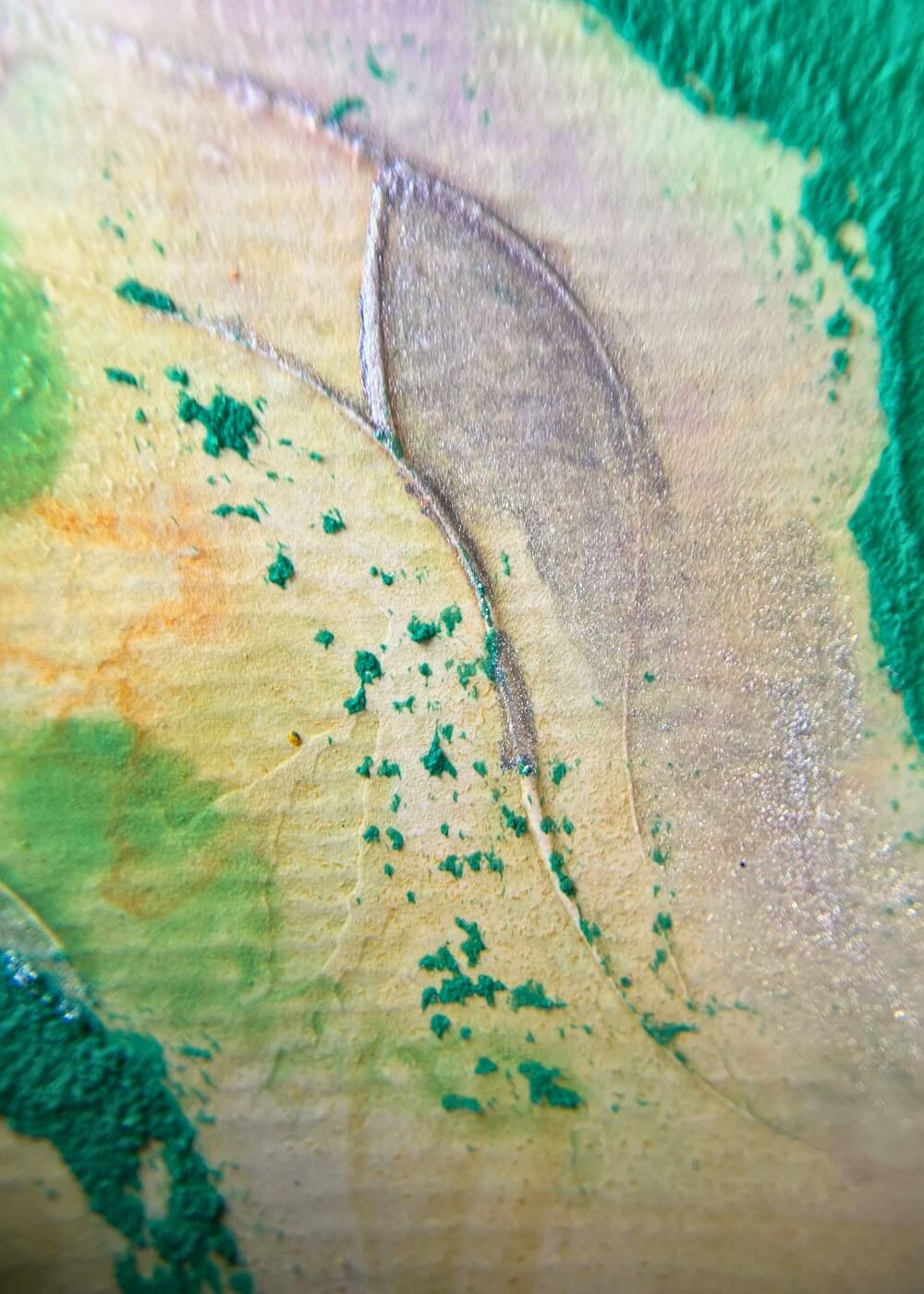 Macro detail of green and orange textures with silver linework in ‘Where silence whispers of freedom’, highlighting tactile depth and symbolic layers of freedom.