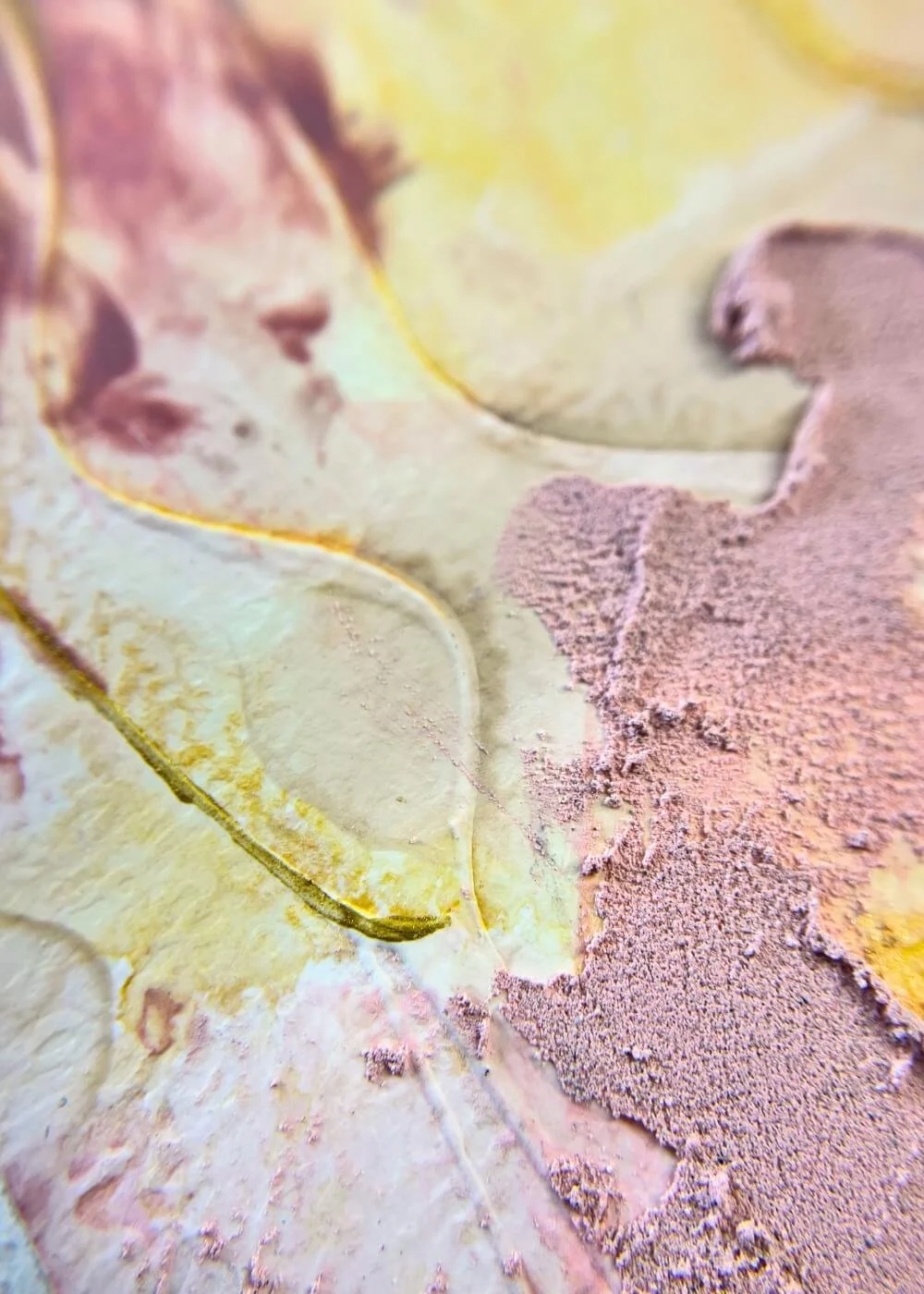 Macro detail of mindfulness artwork, highlighting textured pink surfaces and luminous yellow strokes symbolizing warmth and self-acceptance.