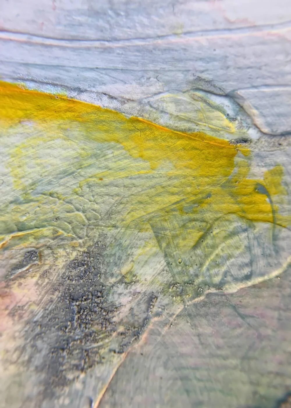 lose-up of golden yellow brushstroke layered over textured grey surface, revealing tactile paint structure of the abstract artwork "Between the Seconds No. 4".