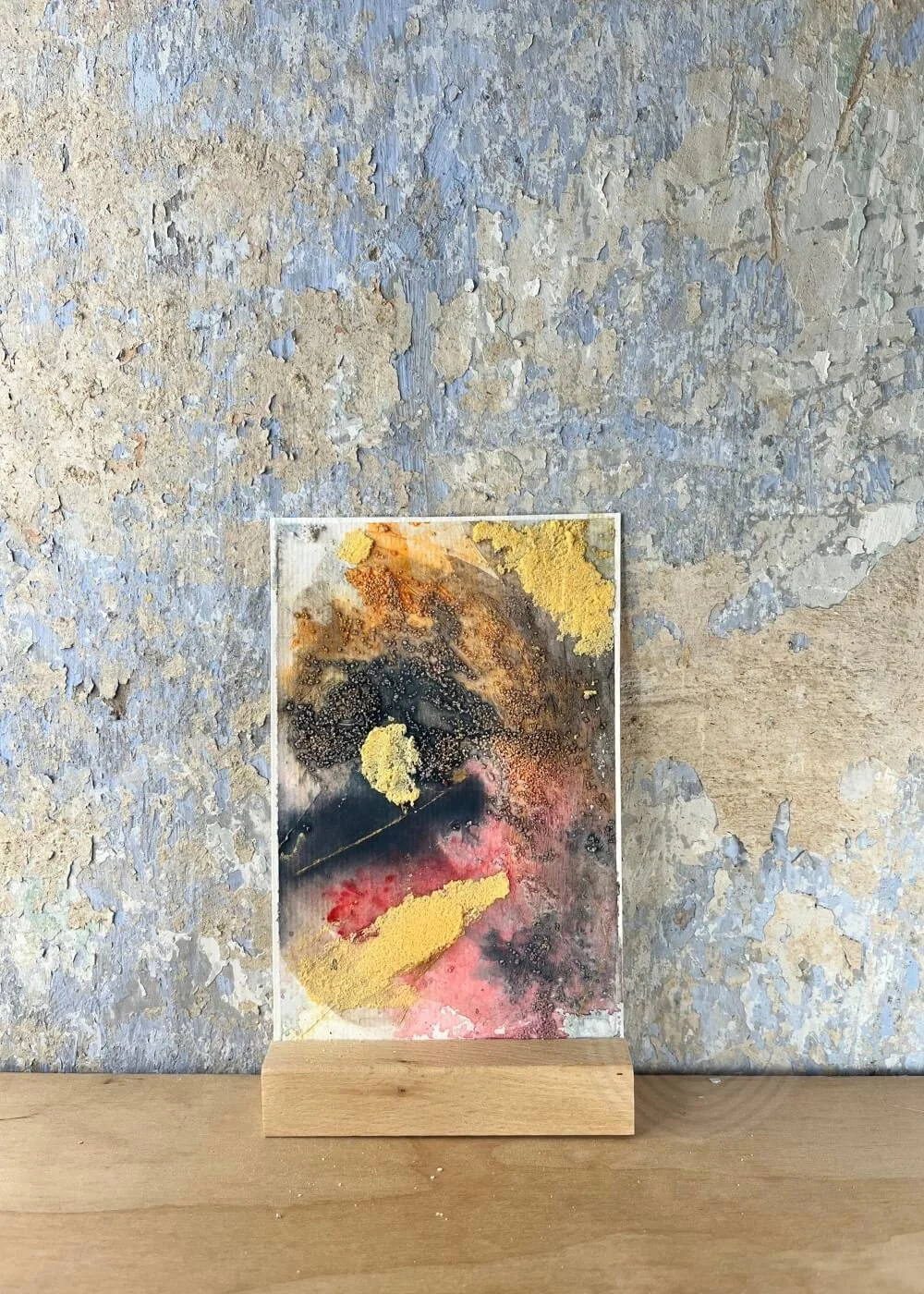 A softly grounded abstract painting in earthen hues, where burnt red and muted gold merge — remnants of warmth that whisper of healing and endurance.