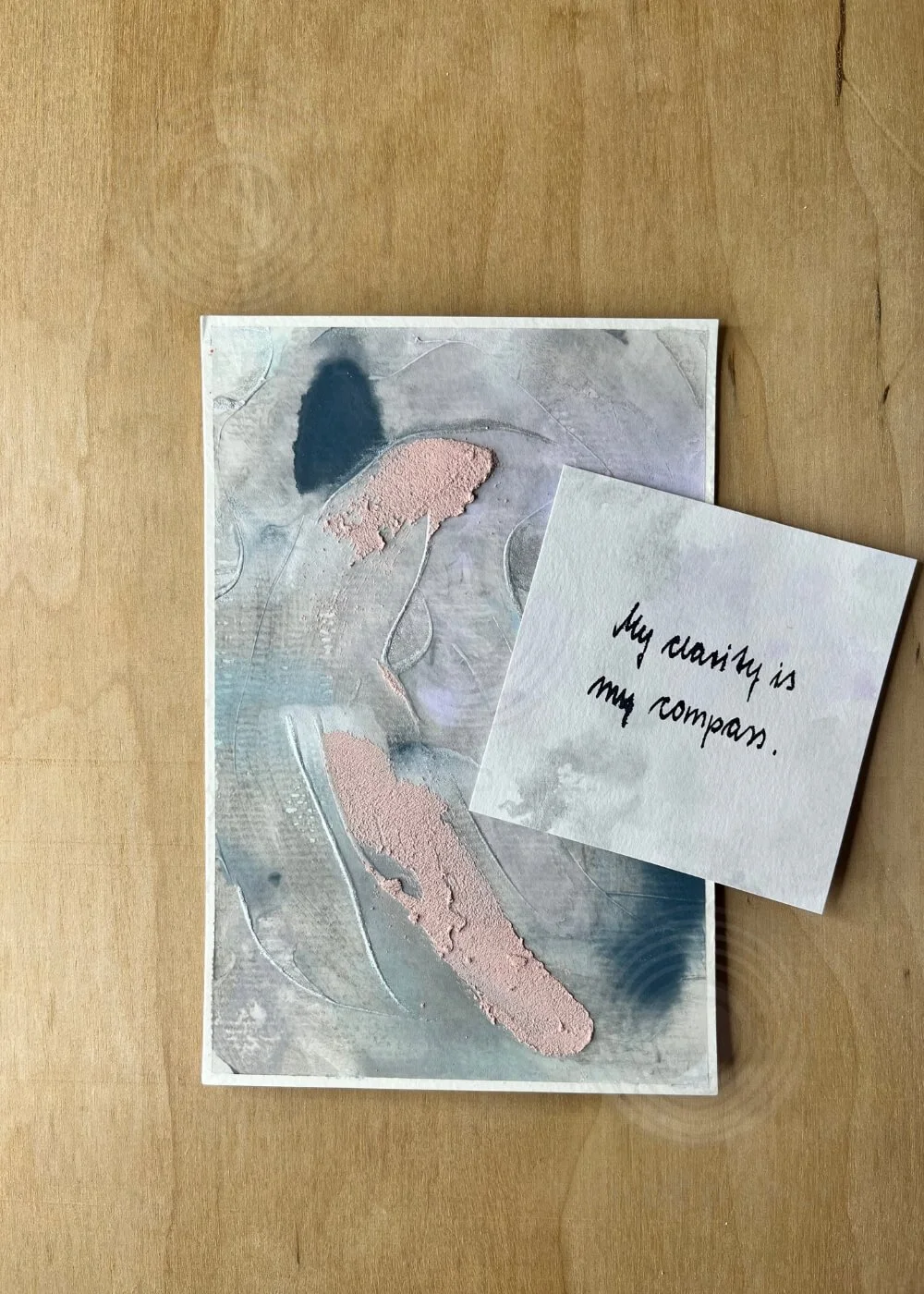 The artwork And Everything Turns Translucent paired with a handwritten note reading ‘My clarity is my compass,’ emphasizing the theme of mindful self-guidance.