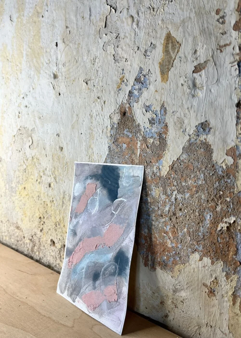 Side view of the artwork Where Stillness Breathes, showing layered textures and soft light revealing subtle depth and organic flow in the mixed-media surface.