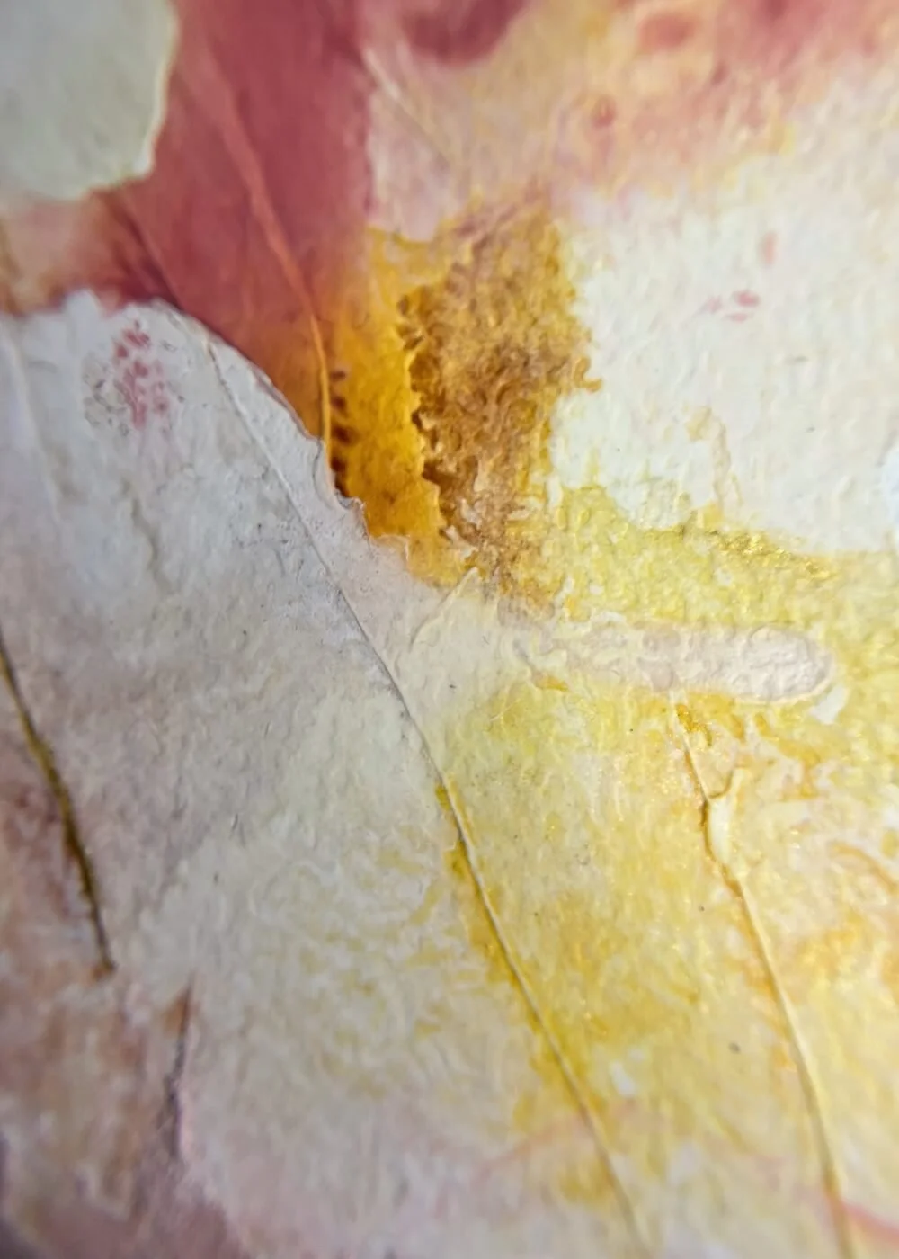 Close-up detail of abstract artwork "Held by Myself  No. 10" highlighting pale yellow and soft rose structures with visible texture and layered paint.
