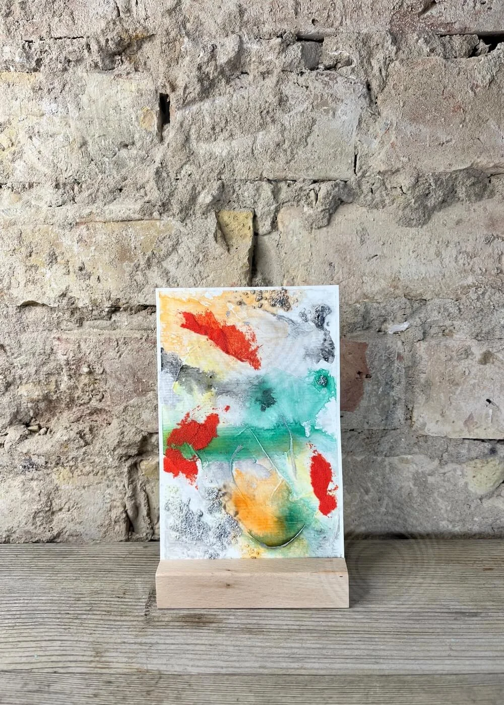 Front view of abstract artwork No. 1 "The light I let in" from the Built of Light series – vibrant composition with green, orange, red, and grey textures symbolizing protection and illumination.