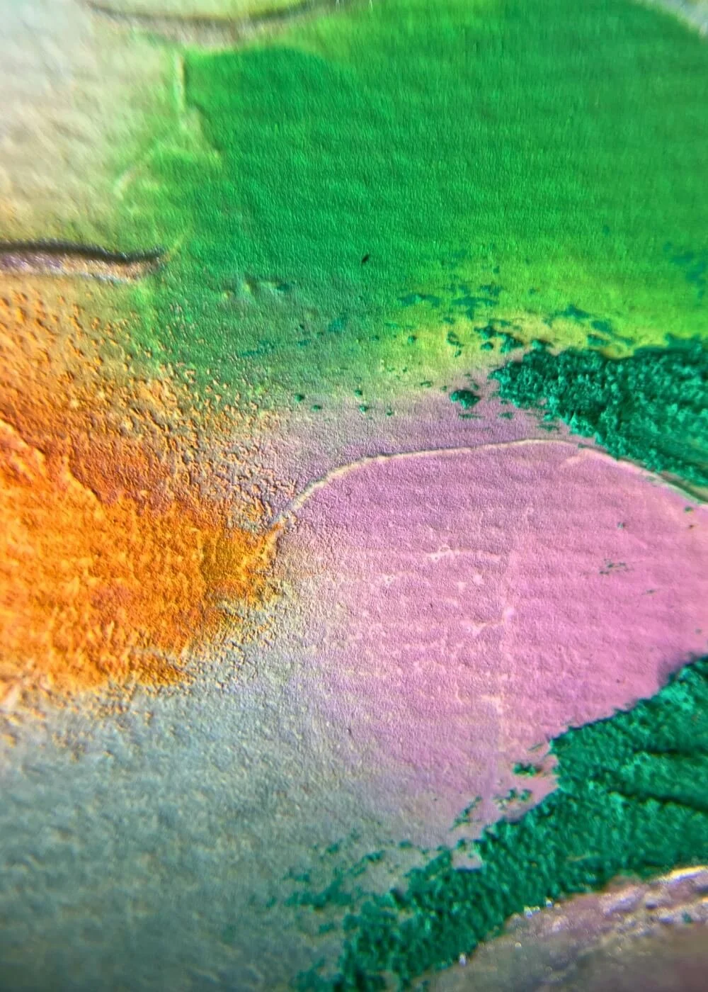 Close-up of lilac and orange pigments merging with green in ‘What was and what will be’, abstract artwork representing release, healing, and transformation.