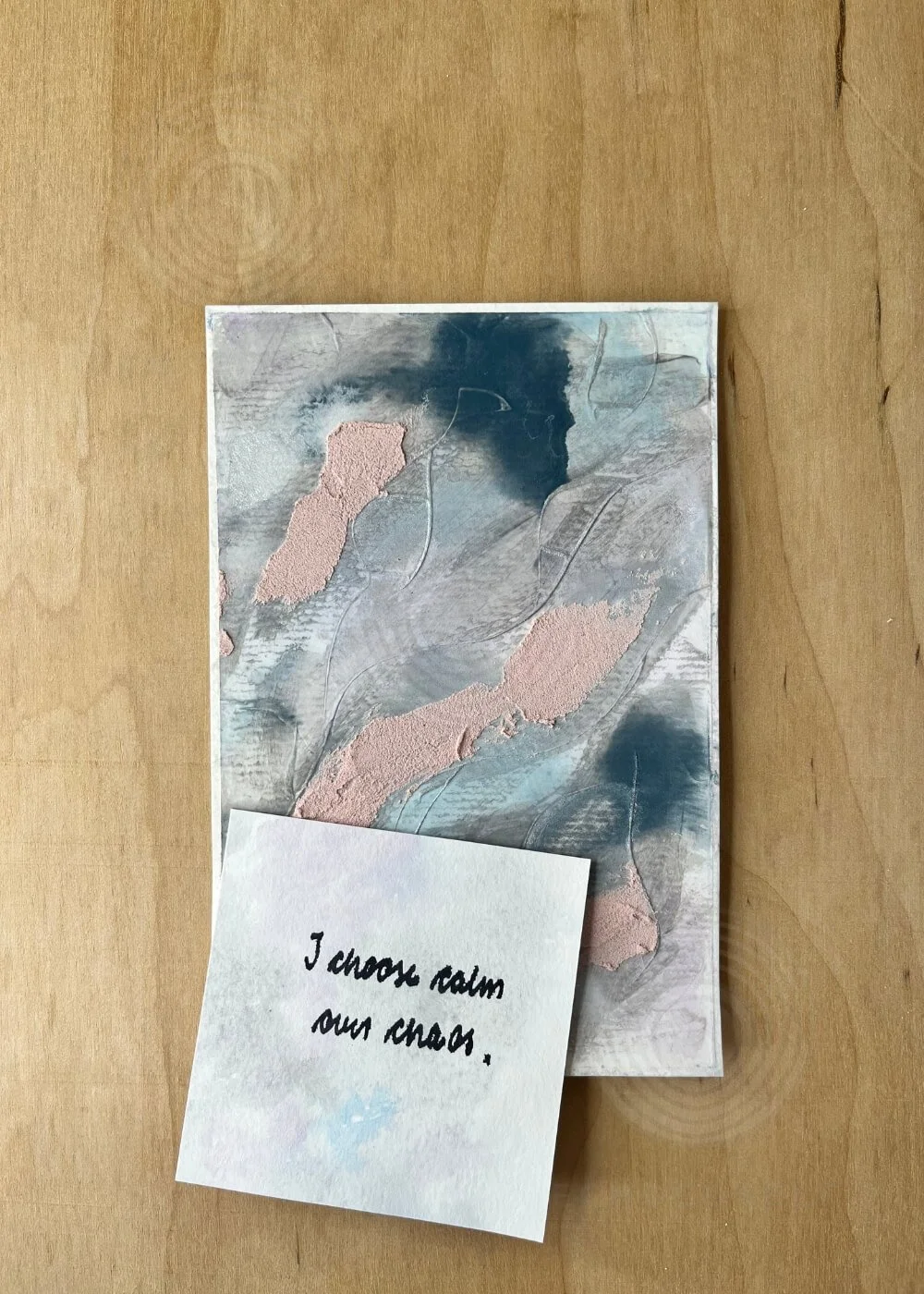 The artwork Where Stillness Breathes accompanied by the handwritten affirmation ‘I choose calm over chaos,’ reflecting the meditative essence of the Between Breaths collection.