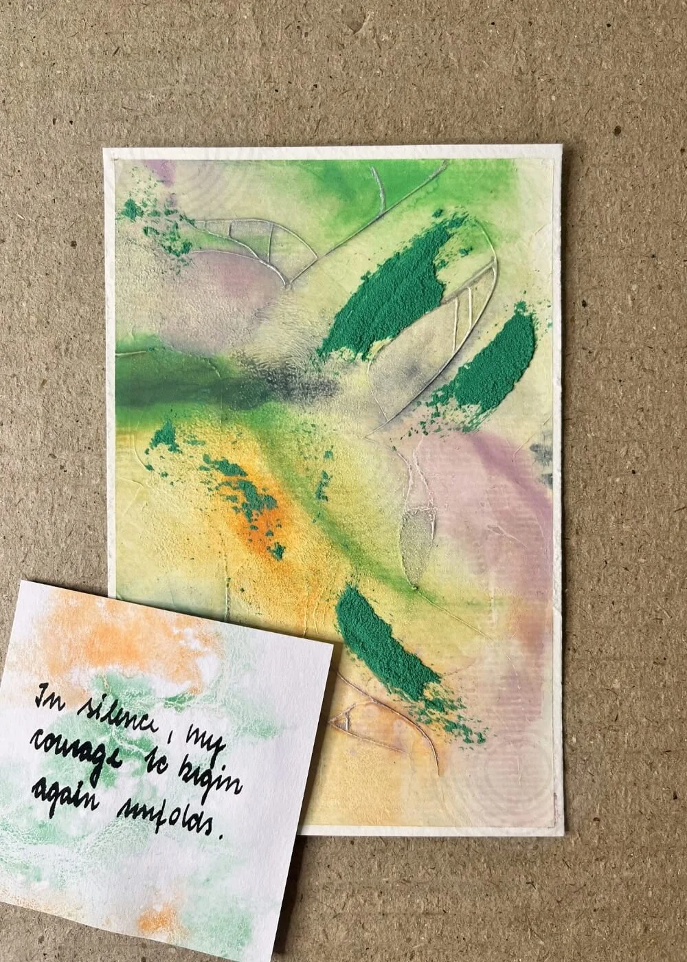 ‘Between Lifting and Letting Go’ artwork shown with handwritten affirmation: In silence, my courage to begin again unfolds, evoking themes of hope, healing, and new beginnings.