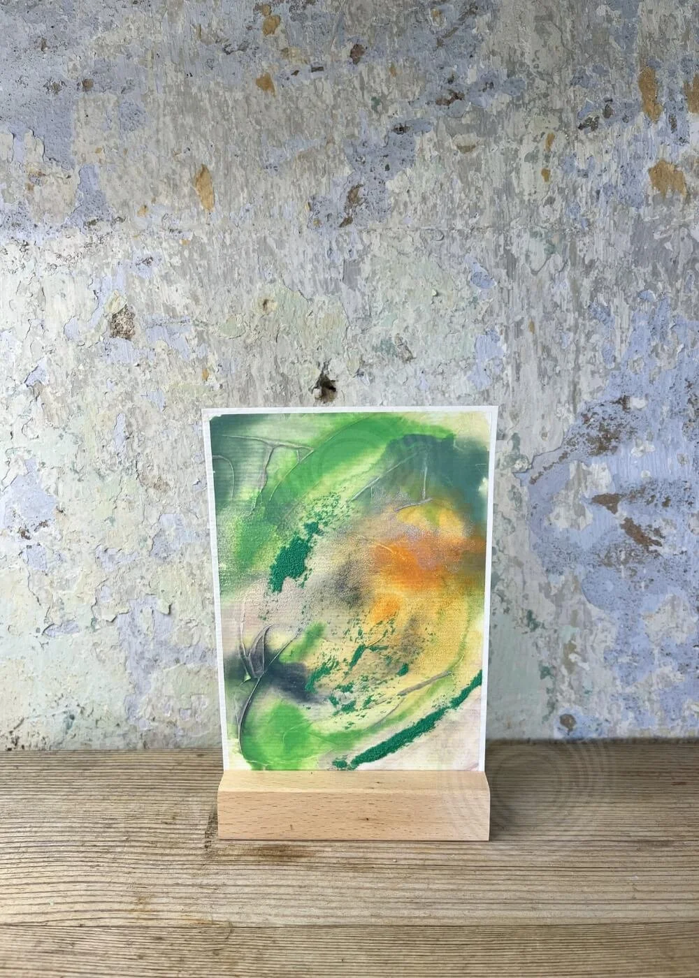 Abstract artwork The beginning glows within me from the Silver Feathers Rising series – green, orange, and golden textures symbolizing new beginnings.