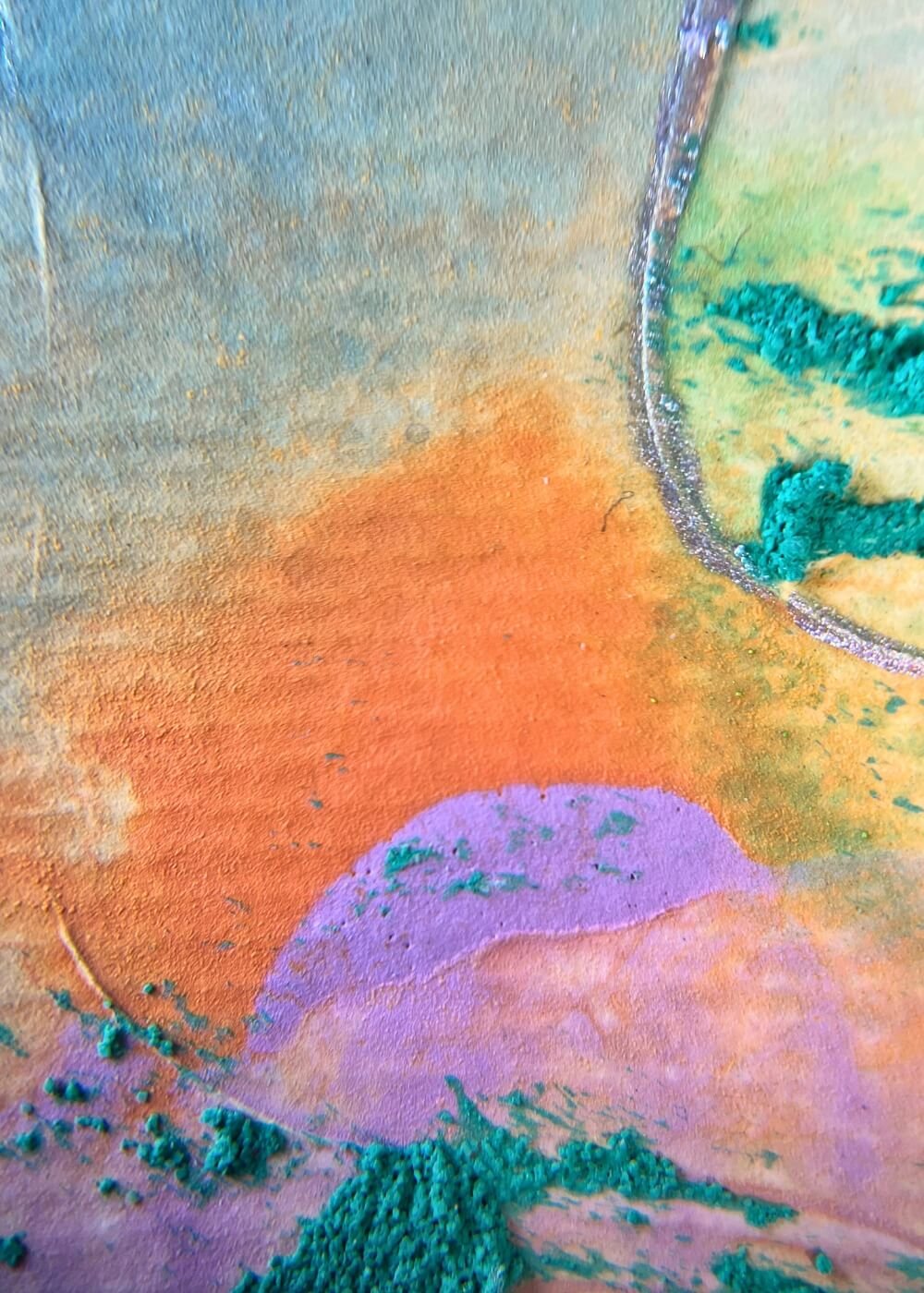 Close-up of orange and violet paint textures in ‘Between the colors’, abstract art evoking transformation, healing, and freedom from the past.