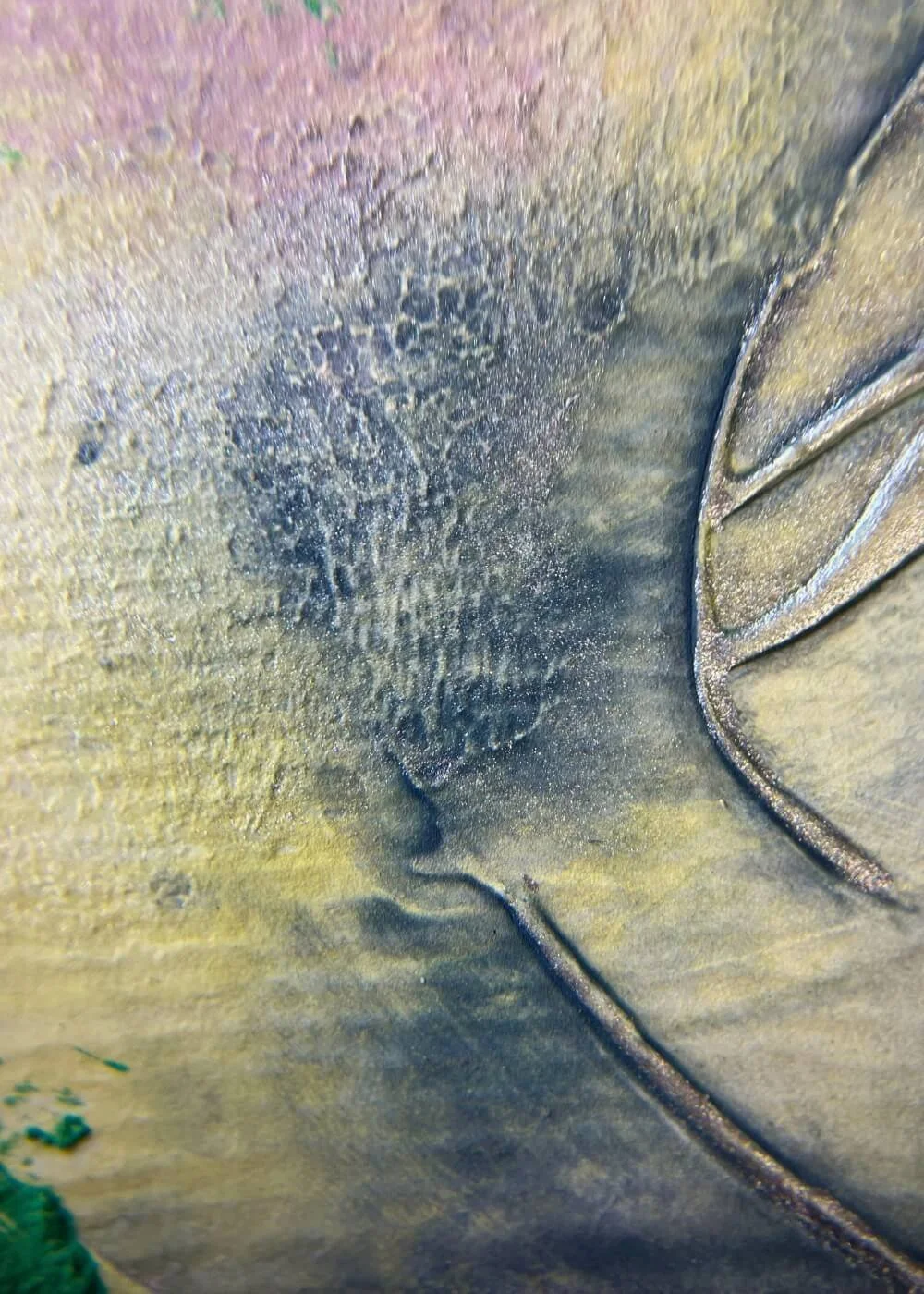 Macro detail of silver and deep green pigments in ‘In the midst of transition’, showing rich textures and layered strokes that symbolize growth and release.