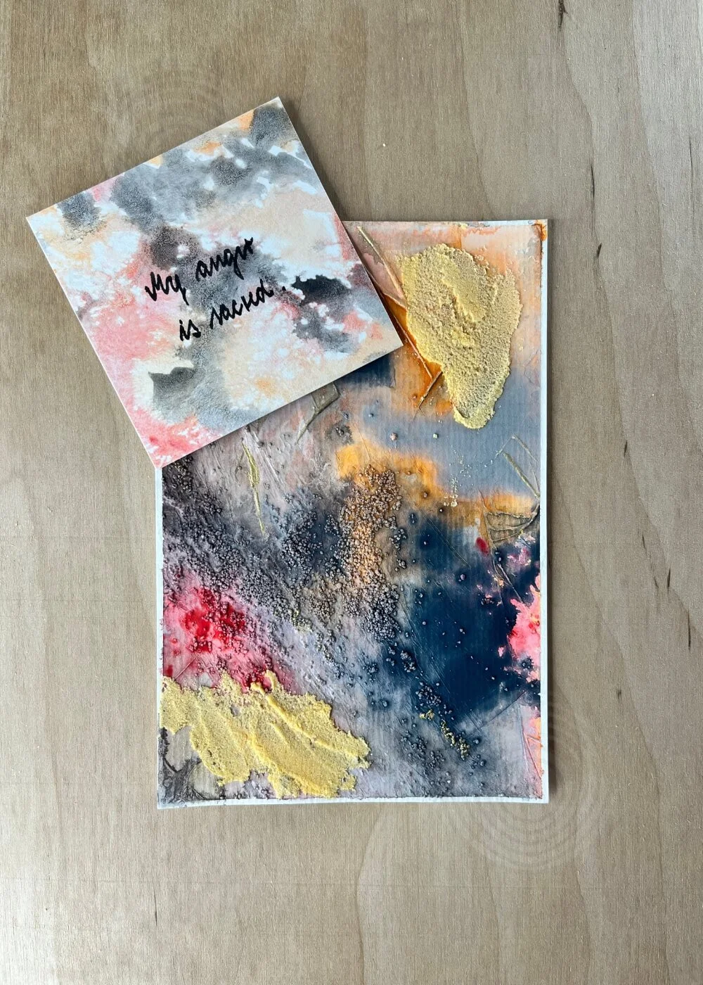 A handwritten card beside the piece reads “My anger is sacred.” The words hover like prayer — honoring the space between release and renewal.