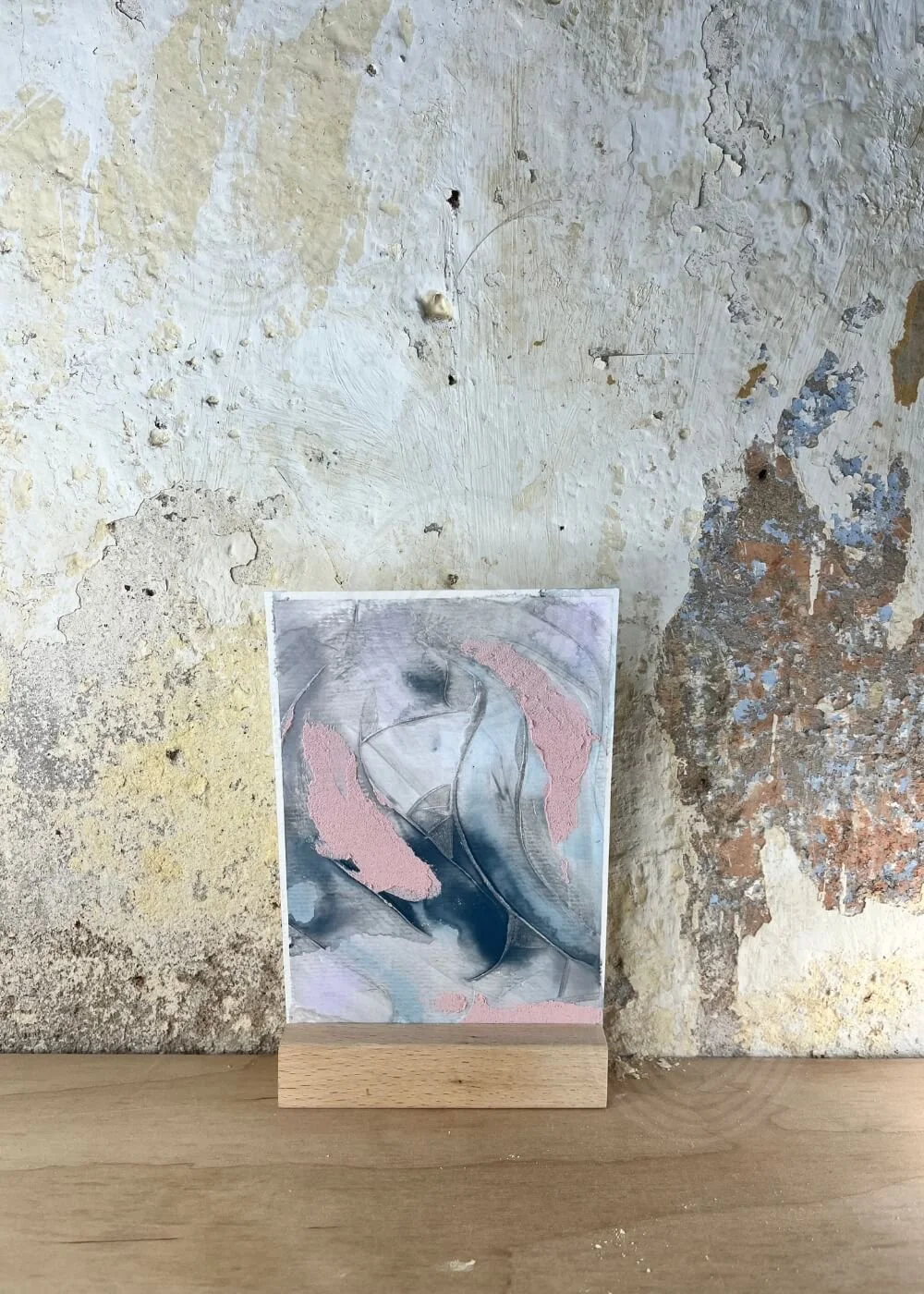 Abstract mixed media artwork titled “A whisper of tomorrow”, in gentle grey-blue and blush tones with flowing organic shapes, symbolizing calm and emotional healing.