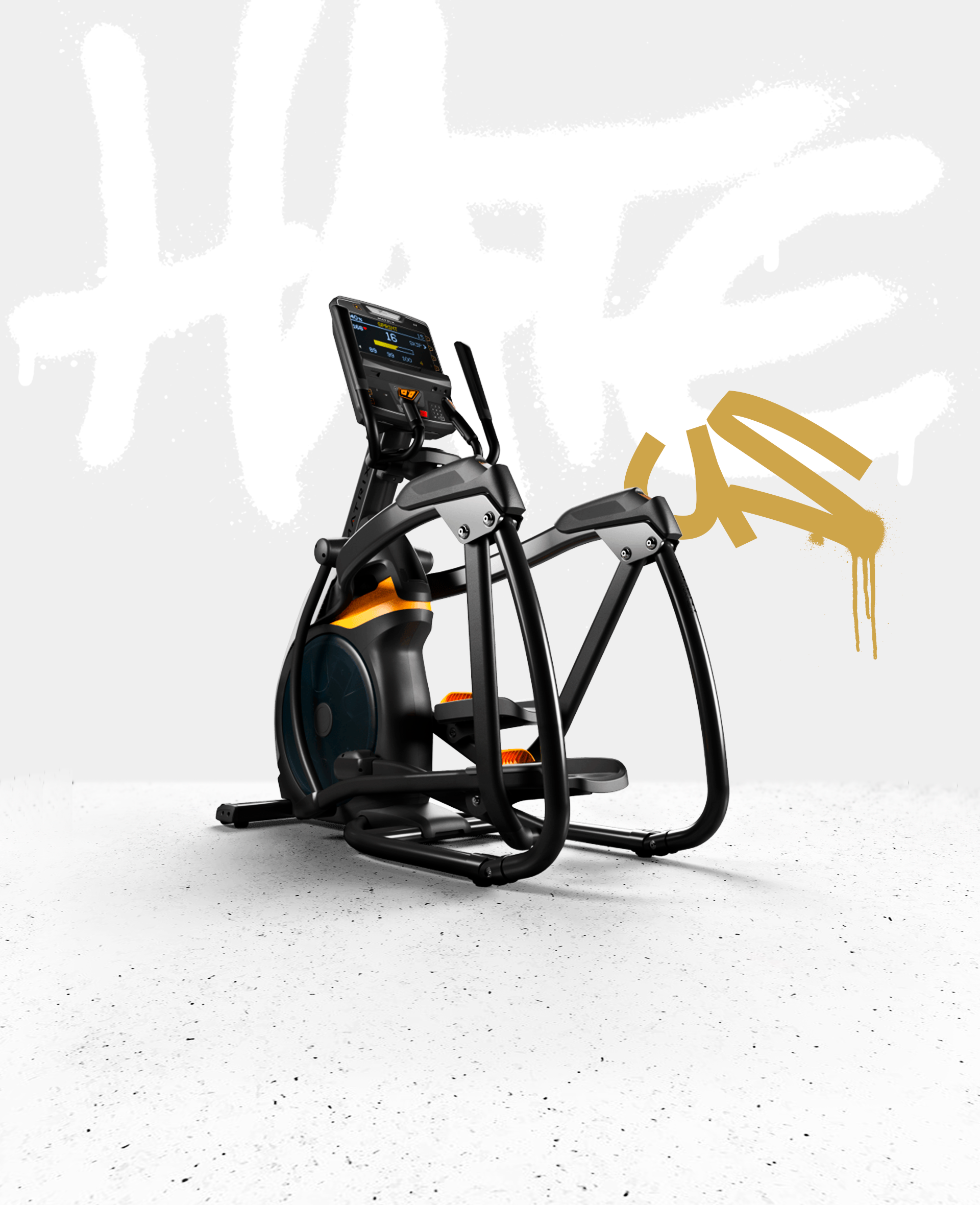 Bicicleta estática moderna en un espacio minimalista con fondo gris y grafiti dorado.