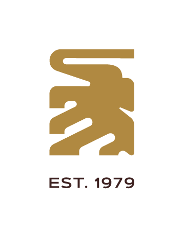 Logo de un elefante dorado, con la leyenda 'EST. 1979' abajo.